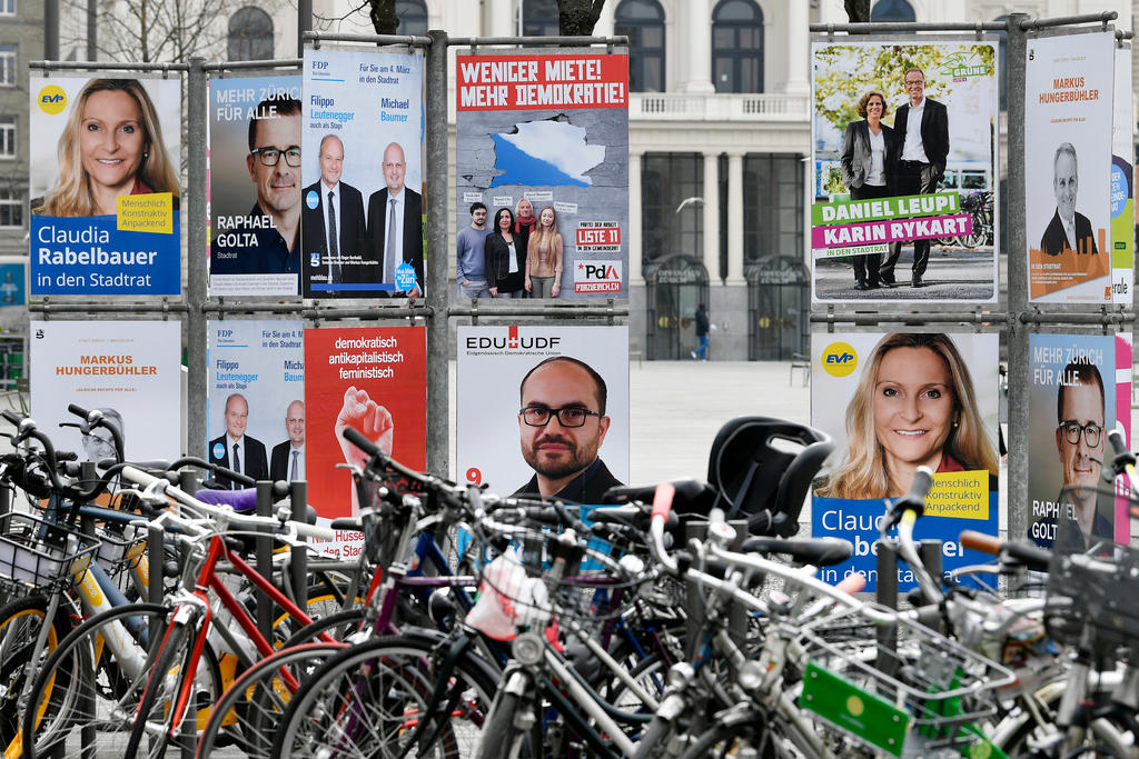Bicycles in front of posters showing candidates for Zurich s elections to the city parliament