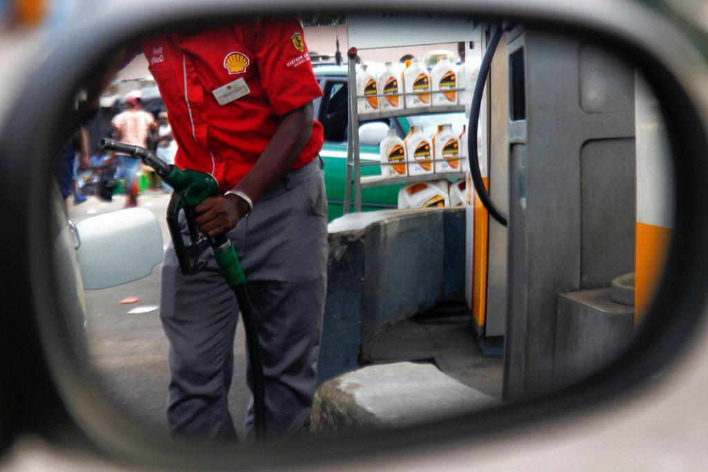 A worker at a Shell petrol station