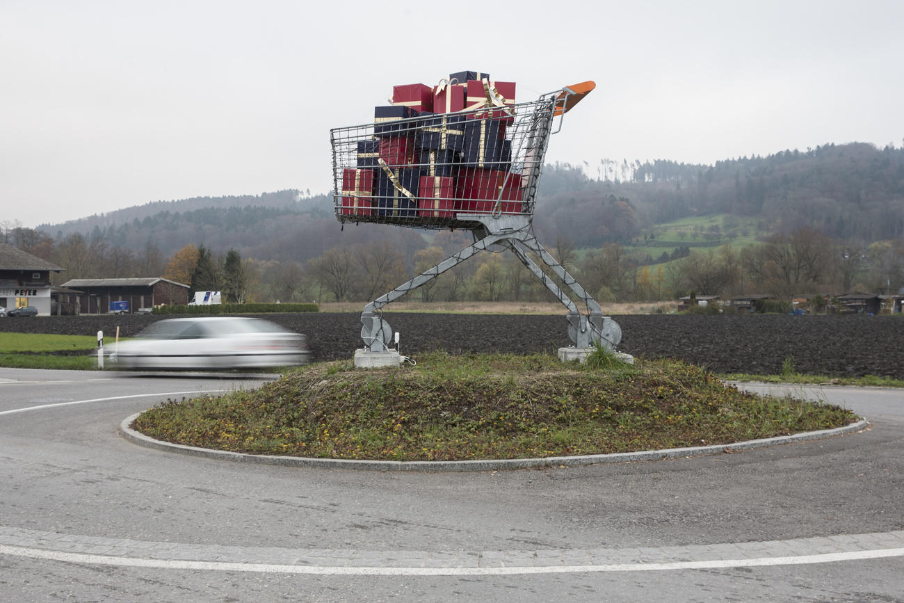 Shopping trolley with gift packages standing in a gyroscope