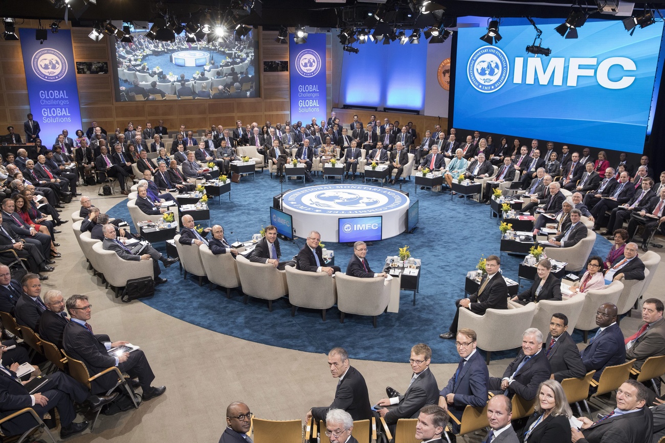 Members of the IMFC pose for family photograph in a meeting room