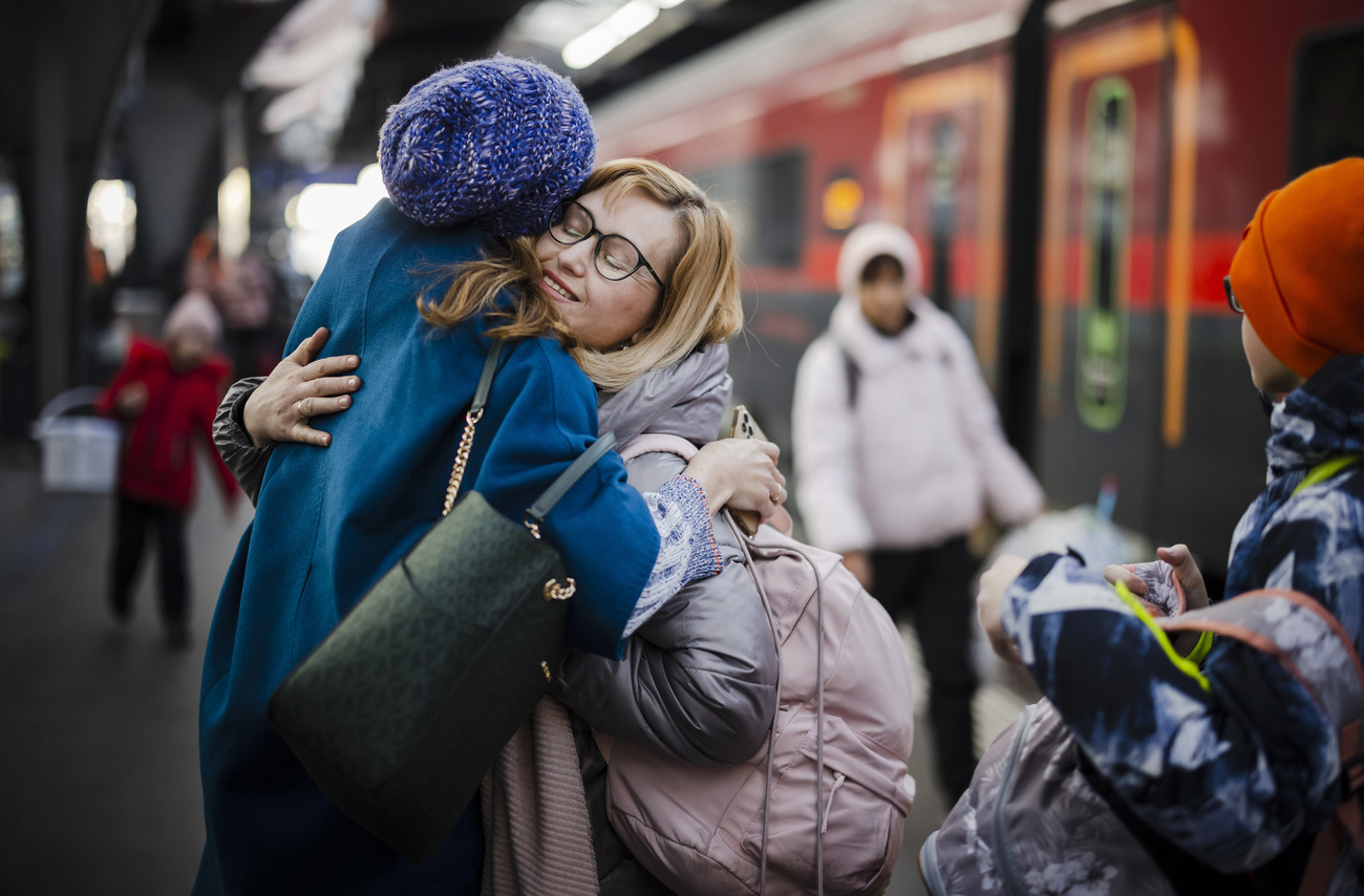 A woman from Ukraine reacts after being greeted at Zurich s central station on March 9, 2022.