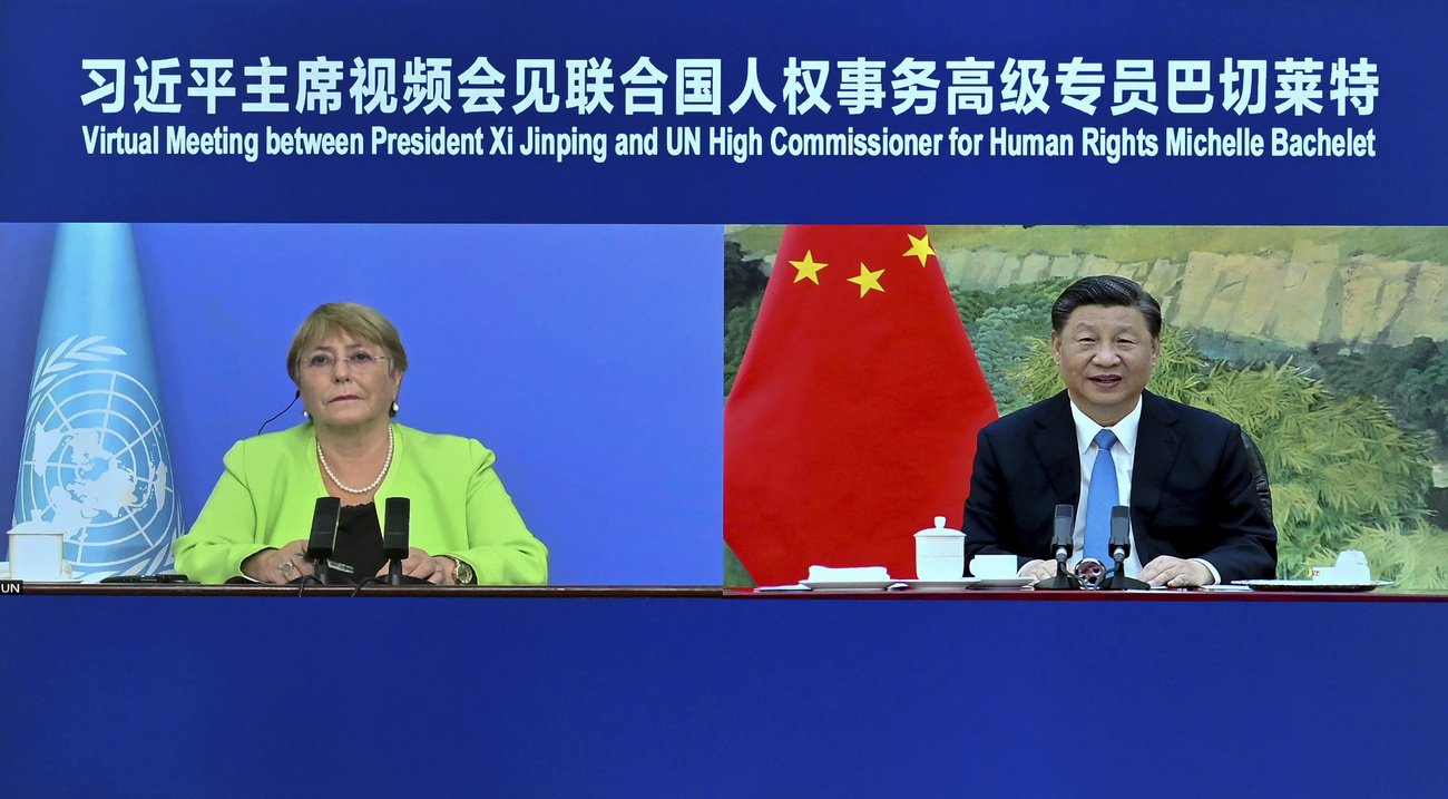Virtual meeting Michelle Bachelet and Chinese president, shown on a screen