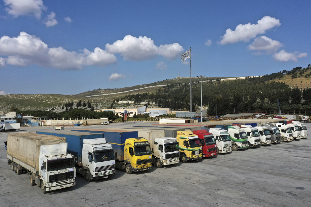aid trucks waiting to cross into Syria