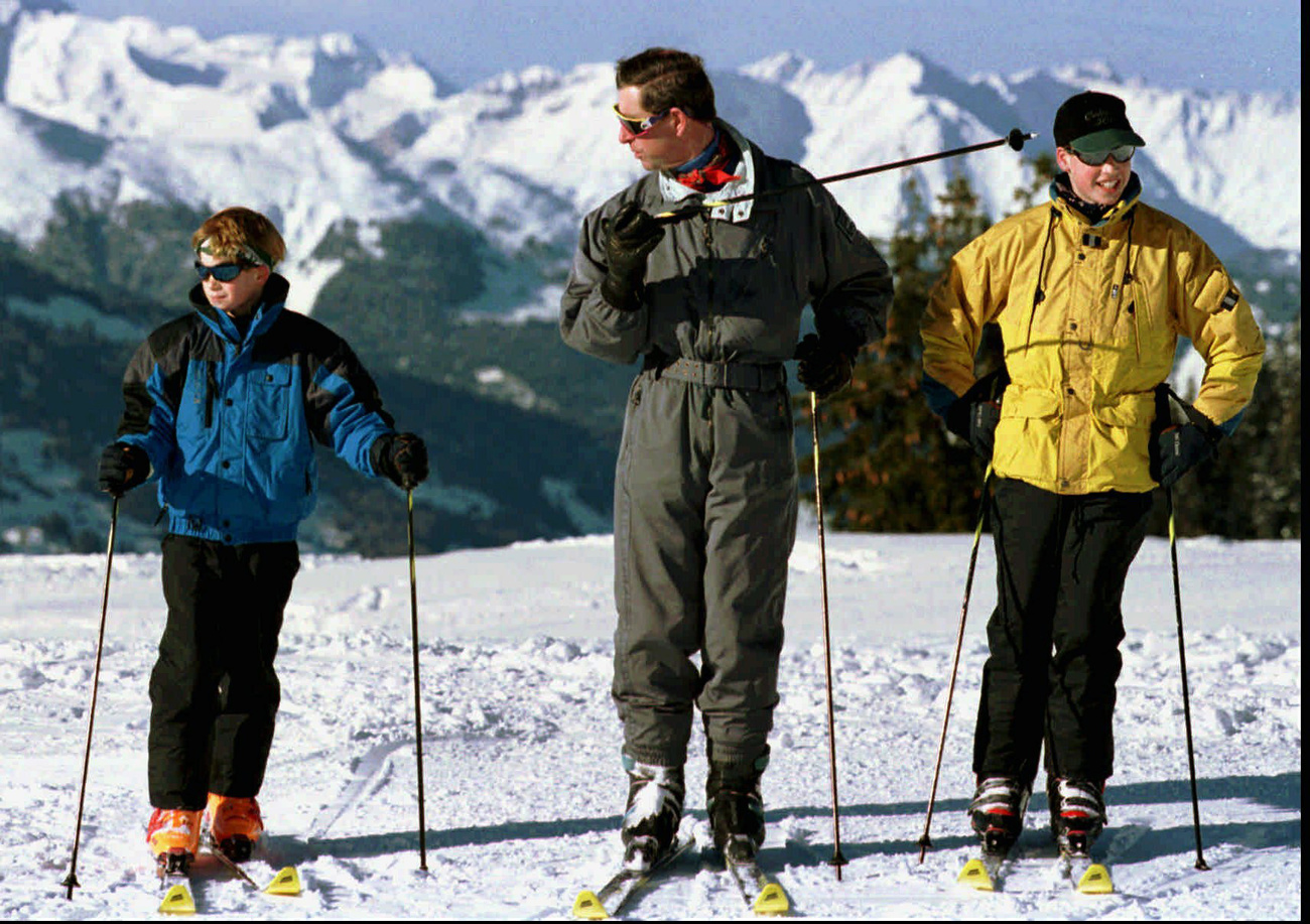 King Charles (then Prince of Wales) with his sons William and Harry at Klosters in 1998.