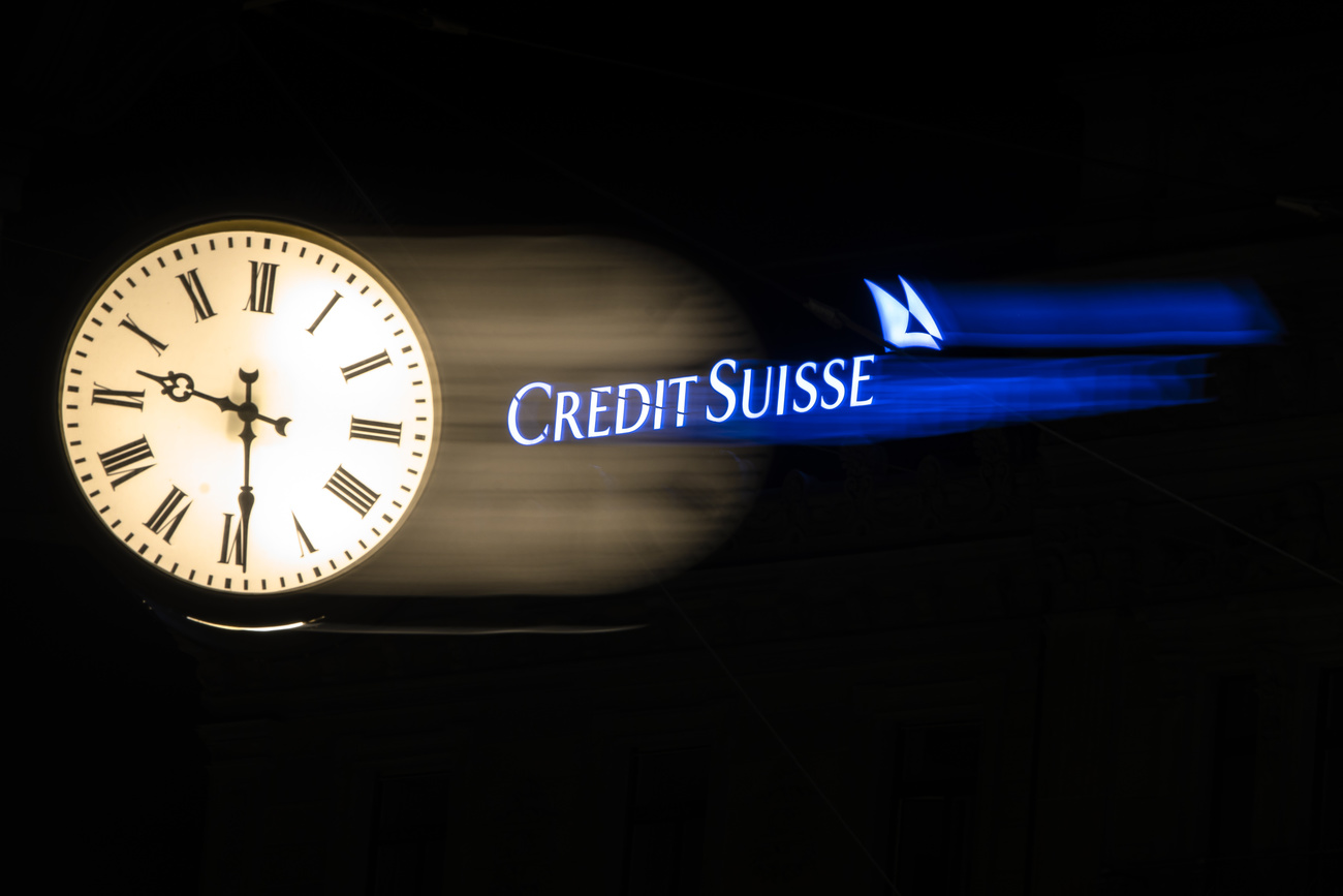 Credit Suisse logo next to a clock