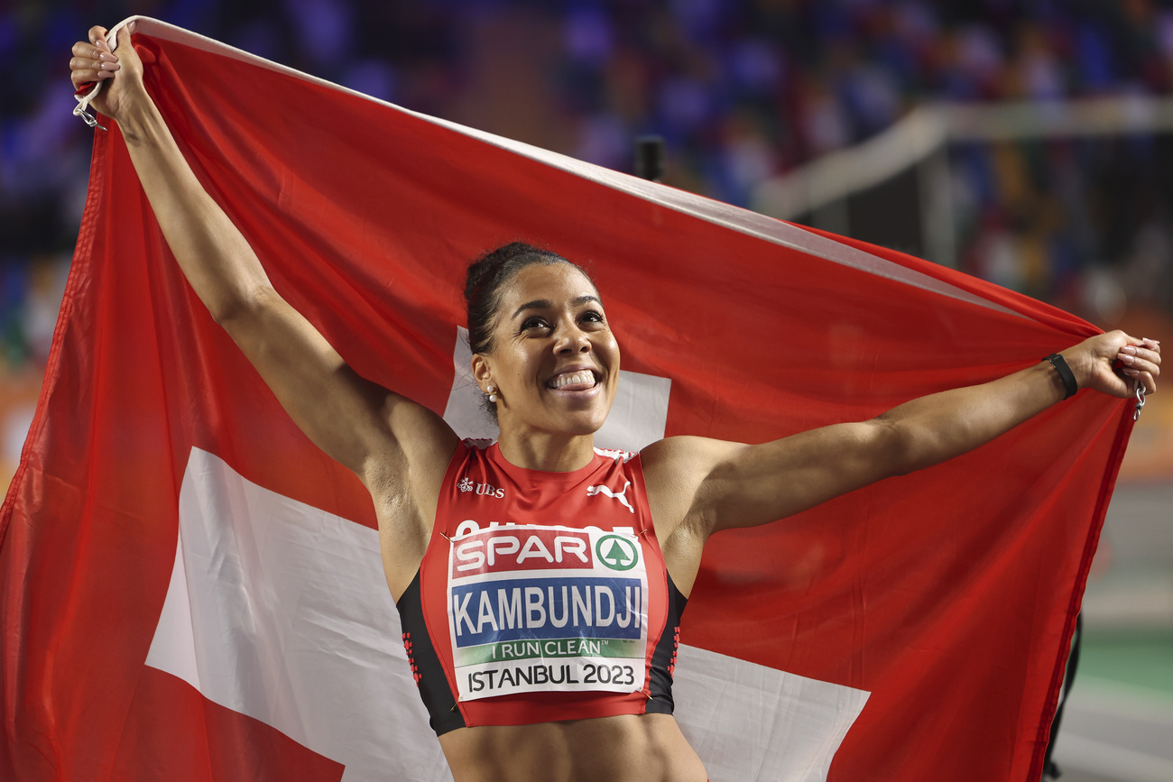 Smiling athlete with Swiss flag