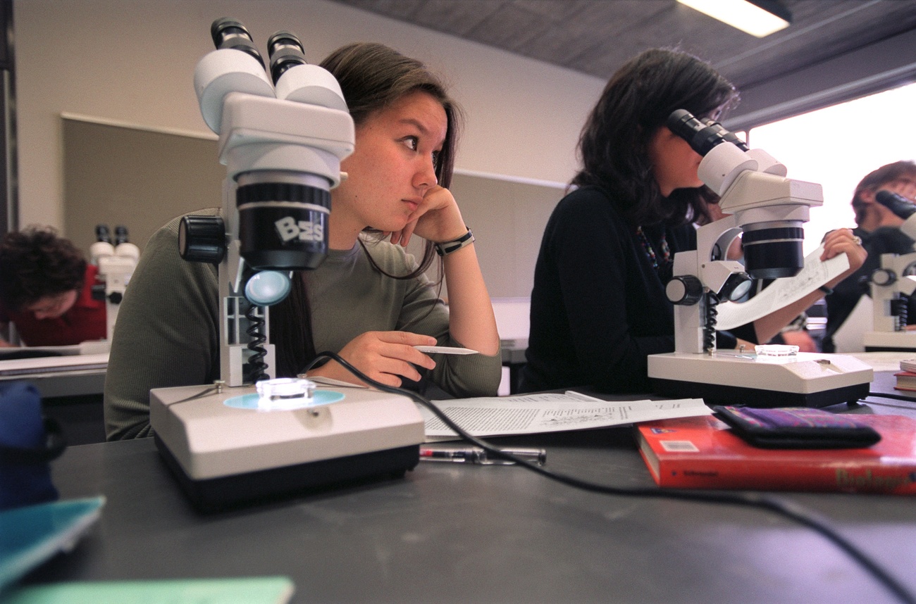 Girl looks bored in science class