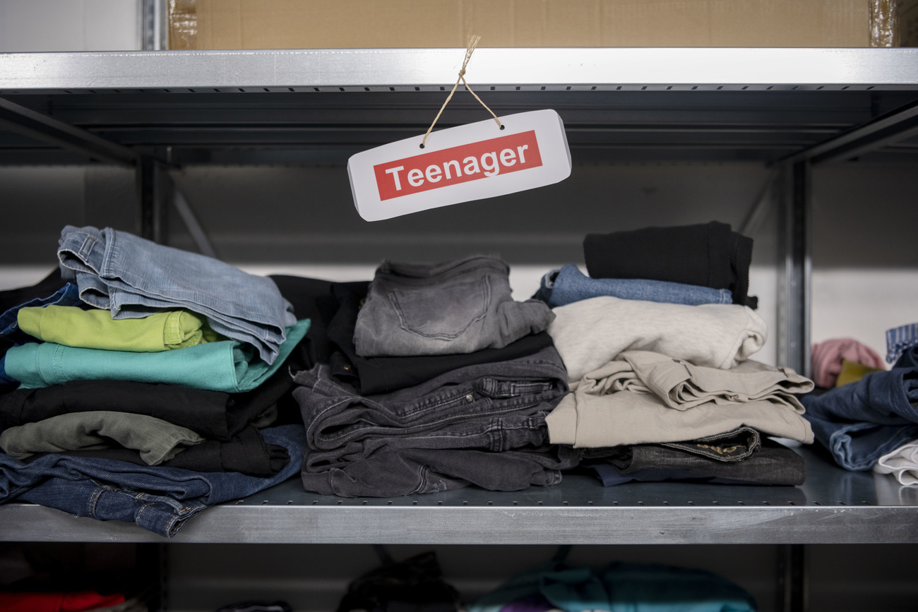 Clothes on bunk with teenager sign