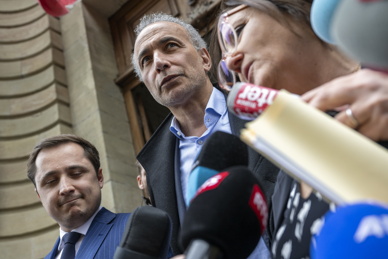 Tariq Ramadan and lawyers meet the press in Geneva after court acquittal.