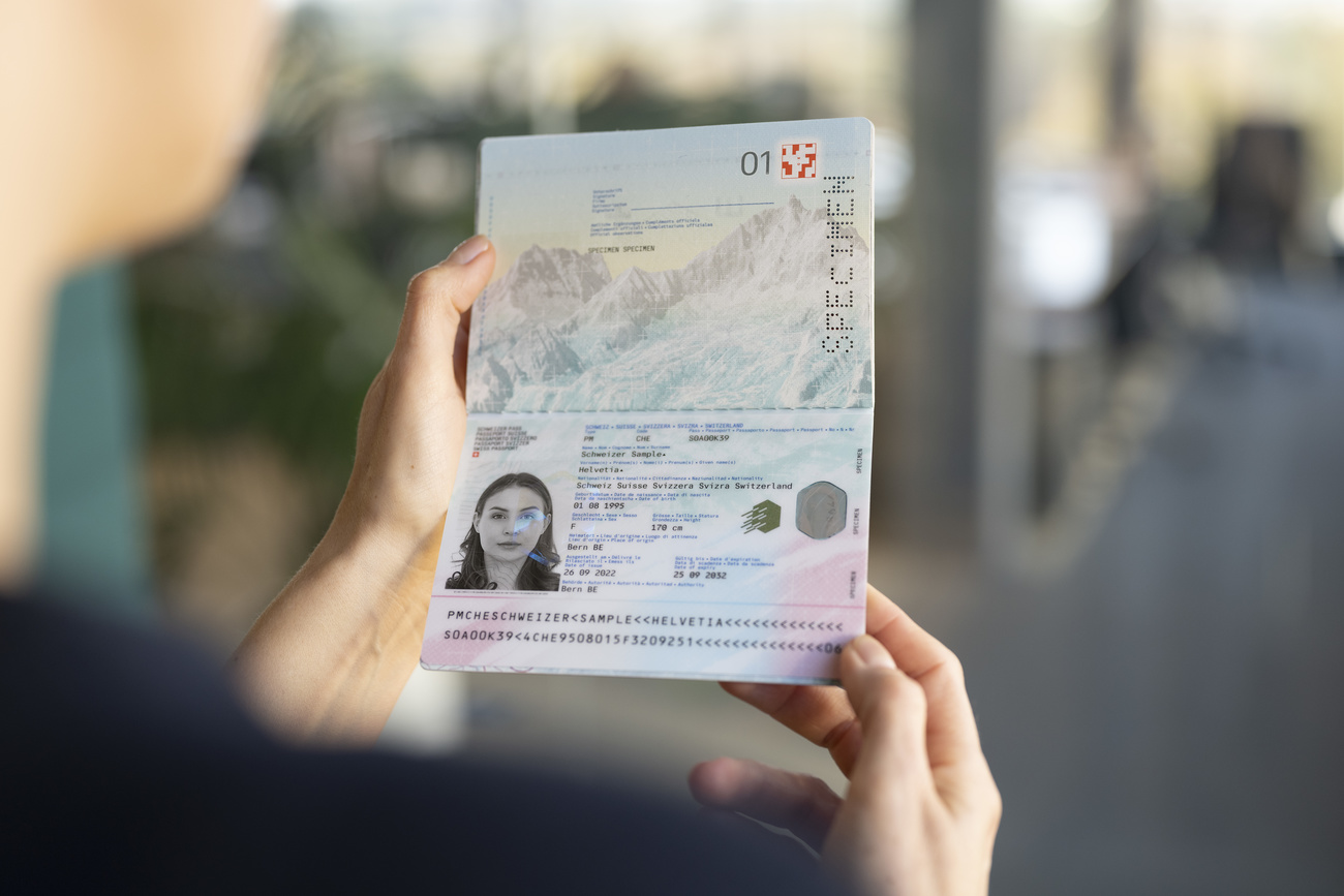 Photo of a woman holding a Swiss passport