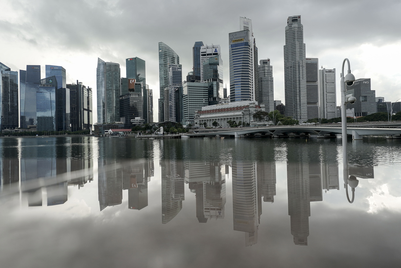 skyscrapers in singapore reflected in water