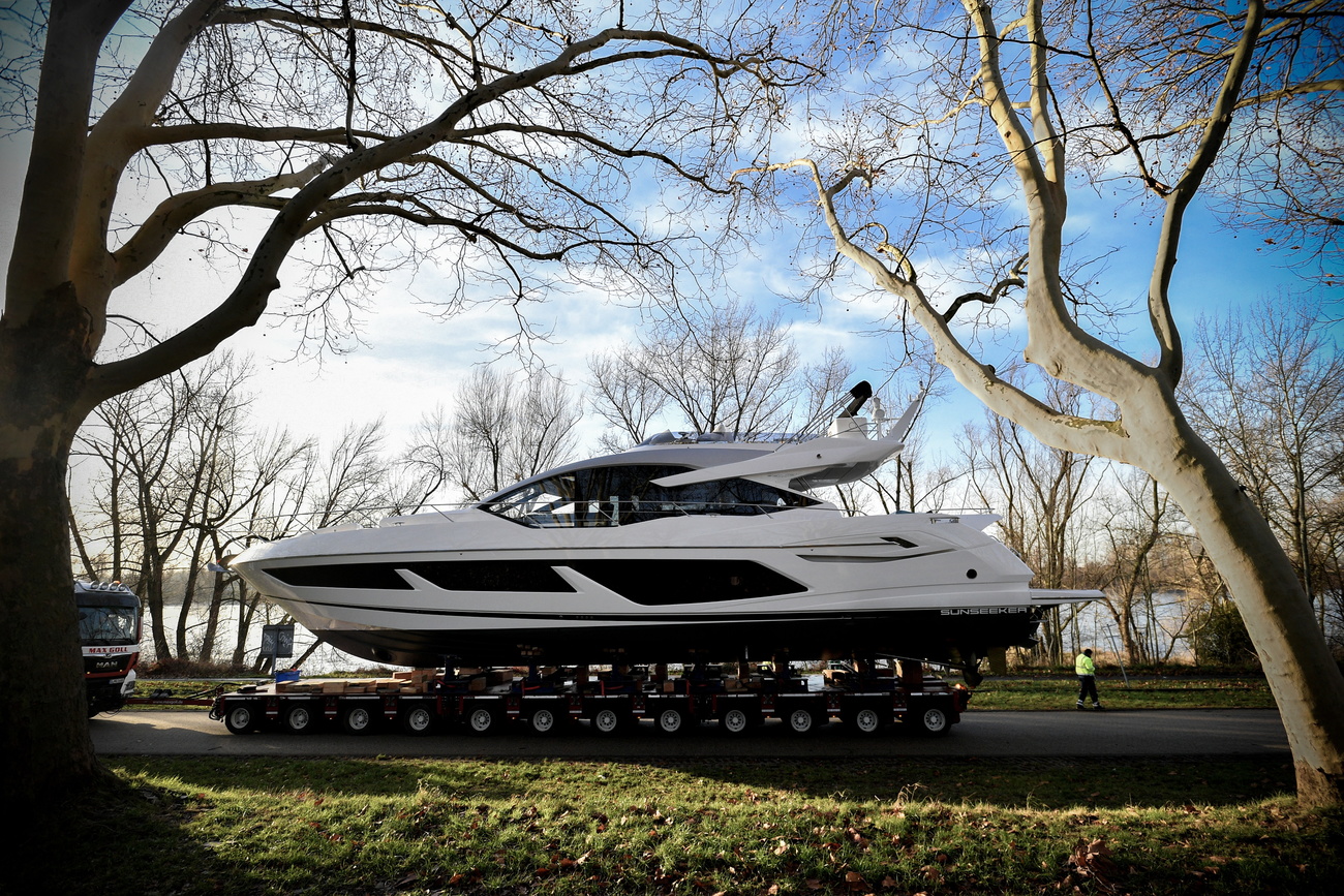 yacht being transported between trees