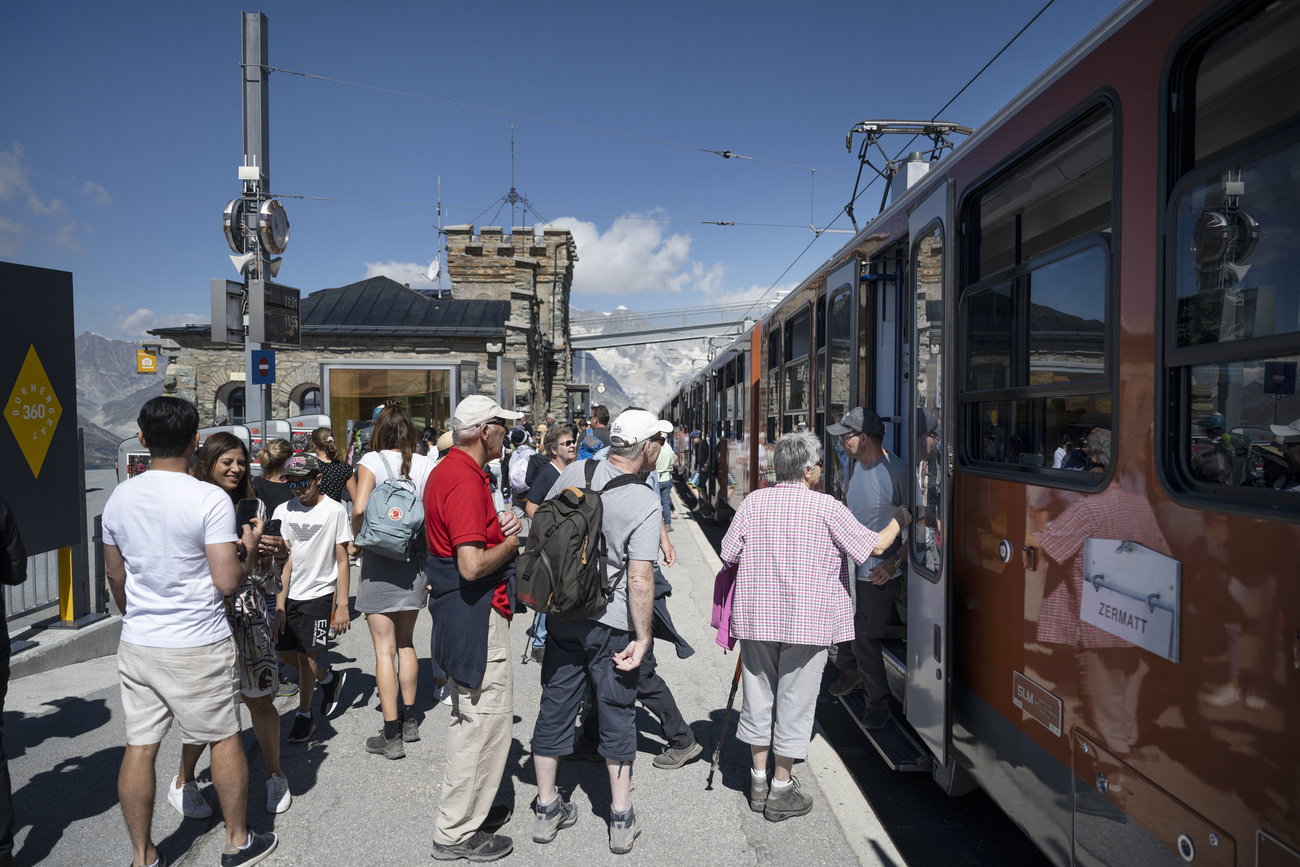 Tourists boarding the train at Zermatt, Switzerland