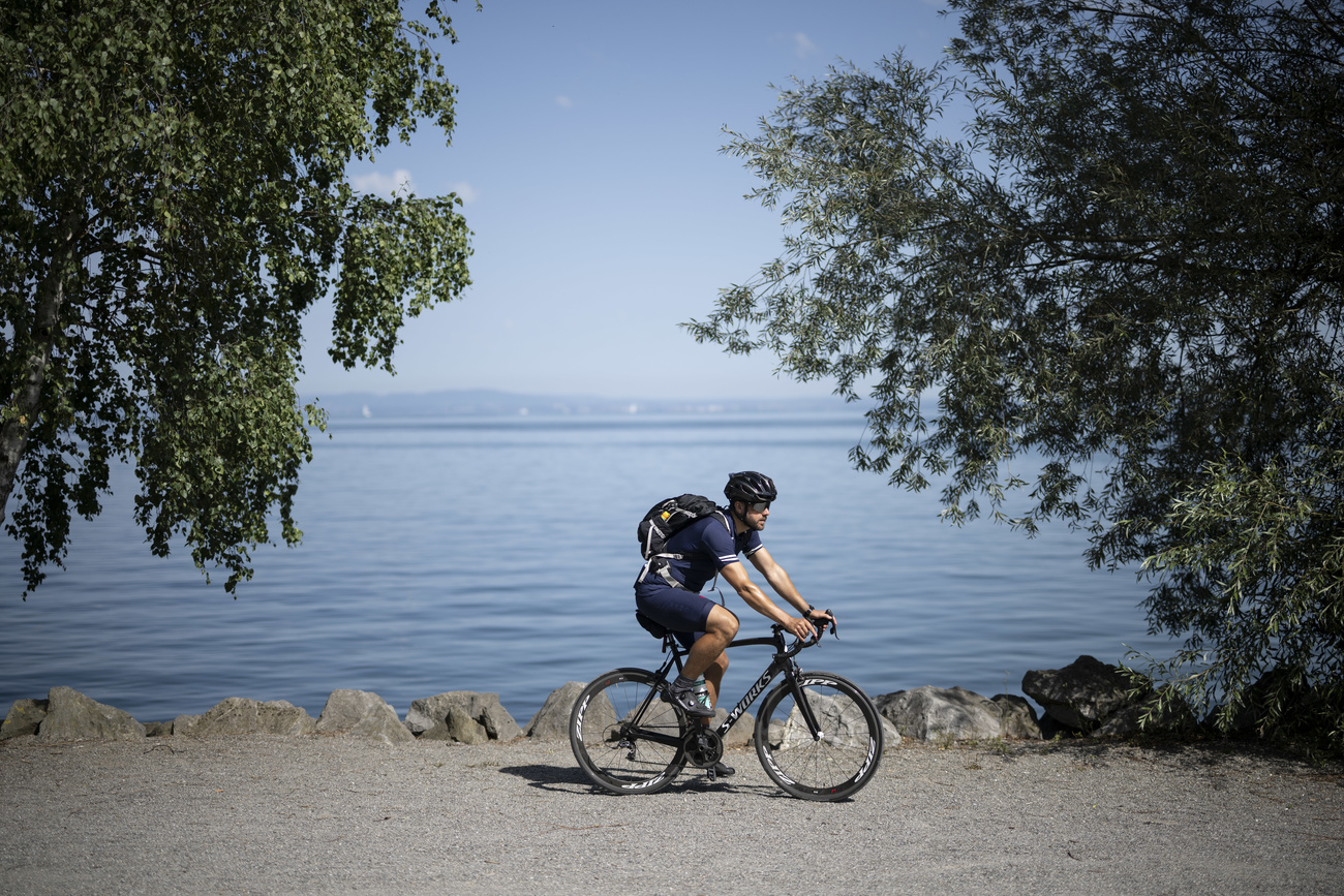 Cyclist by a lake