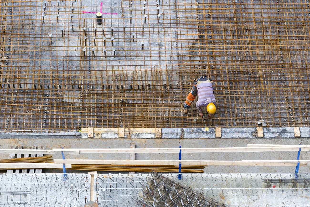 Construction worker on a copper grid