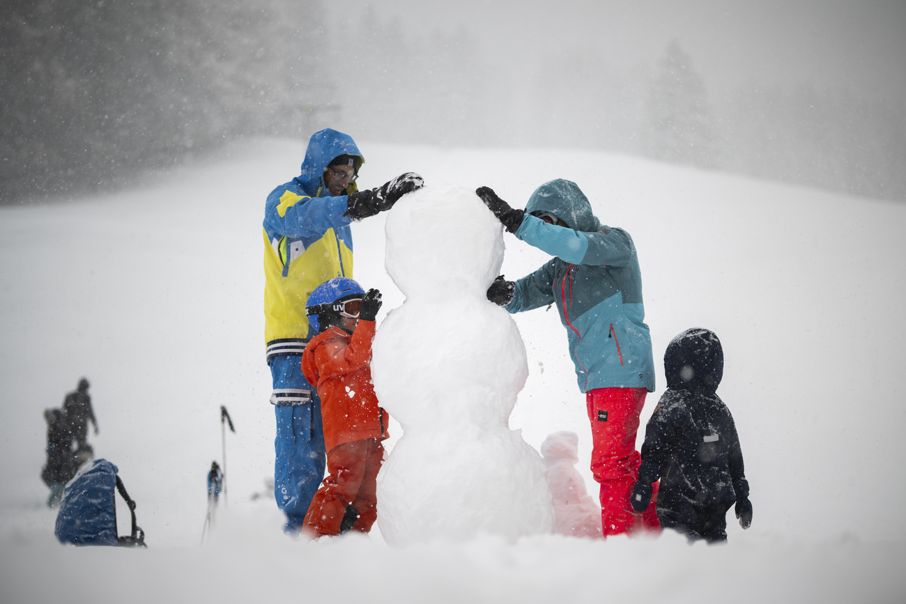 Family making a snowman