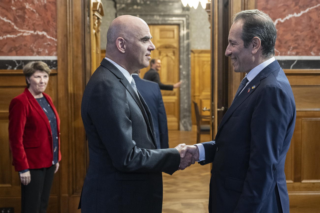 Swiss President Alain Berset greets Petros Mavromichalis, ambassador to the EU on January 11, 2023, in Bern.