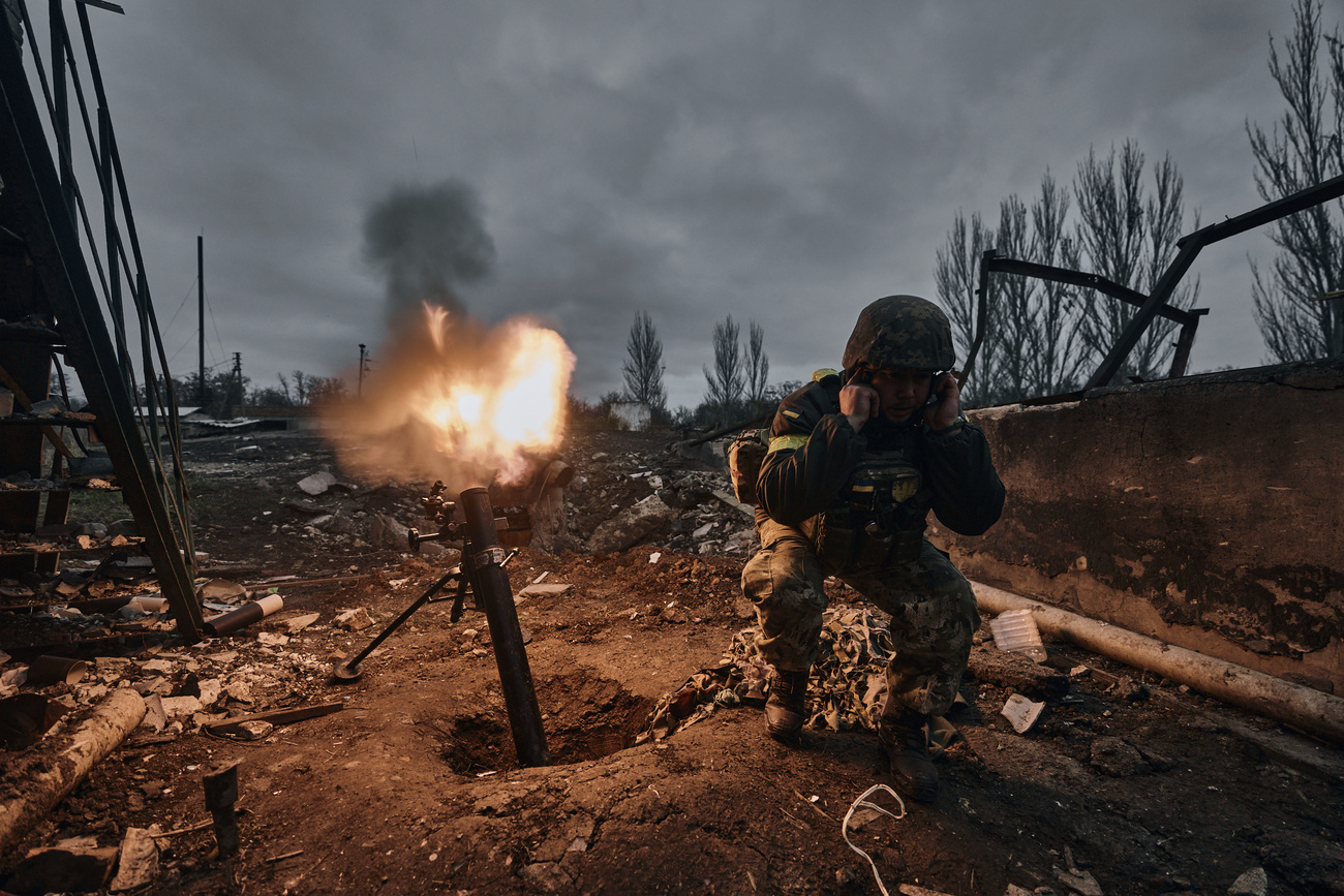 Ukrainian soldier firing a mortar