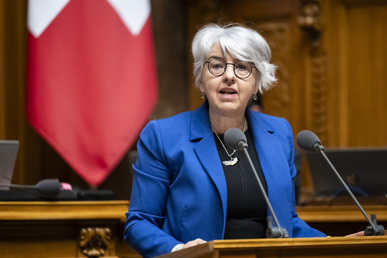 A picture of Swiss politician Elisabeth Baume-Schneider wearing a blue blazer, speaking before the House of Representatives.