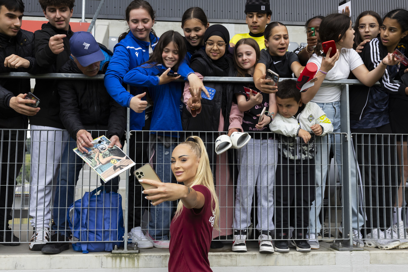 Alisha Lehmann takes pictures and signs autographs