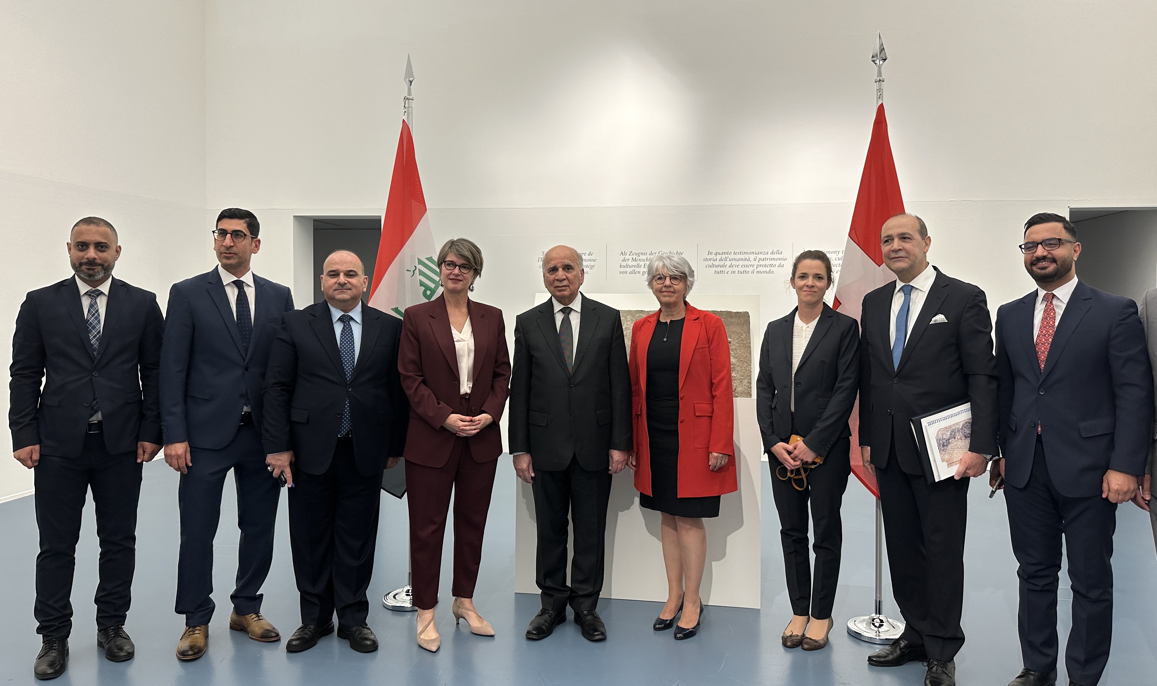 Iraqi Foreign Minister Fuad Hussein and Swiss Interior Minister Elisabeth Baume-Schneider and diplomats pose after the official restitution of looted artifacts at the Federal Office of Culture, Bern, on Friday, May 24, 2024.