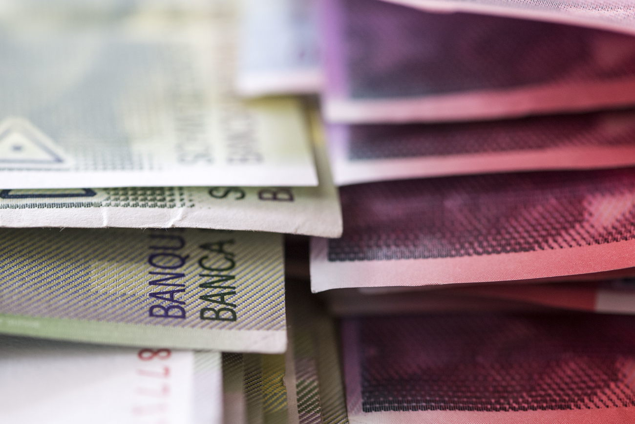 A close-up view of Swiss banknotes.