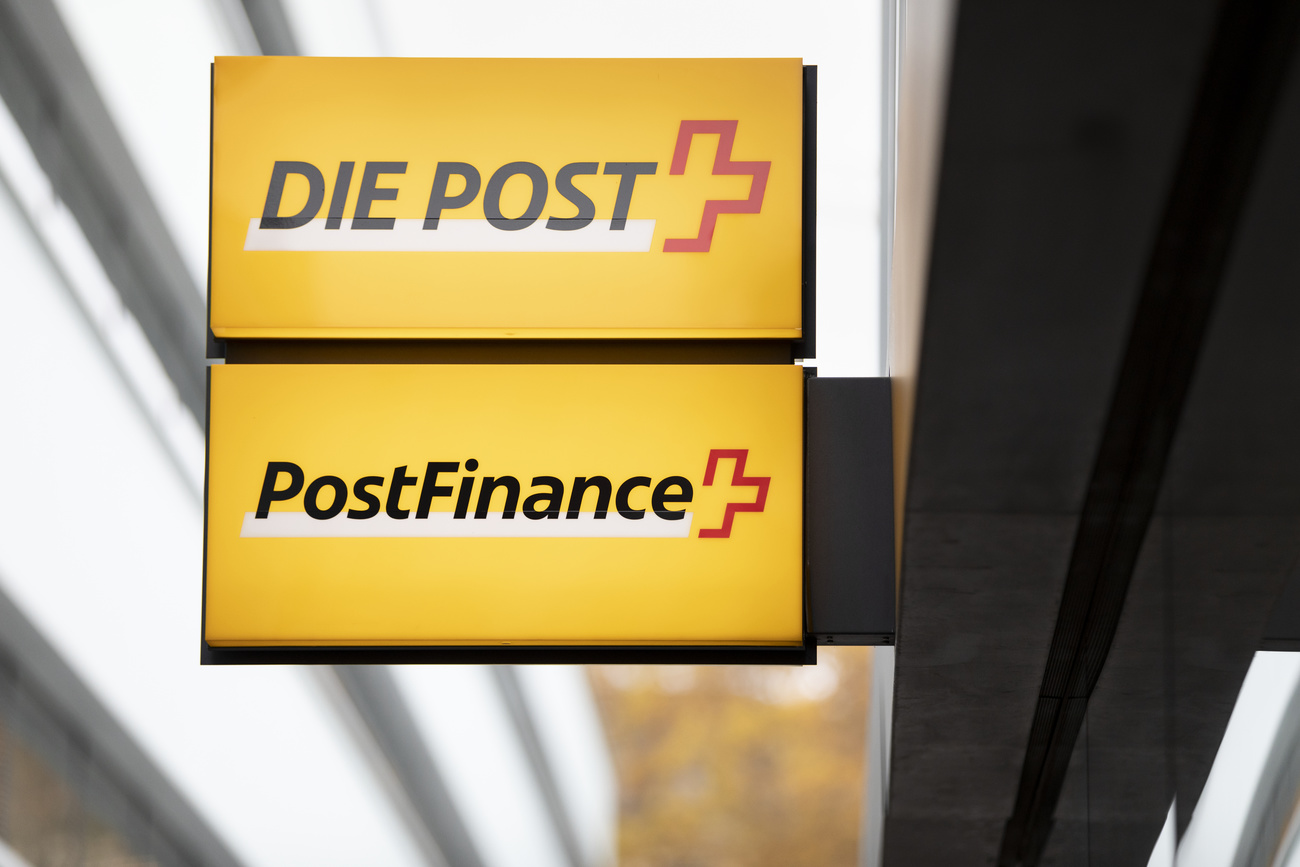 Signs for Swiss corporations Die Post and Postfinance are displayed on a building.