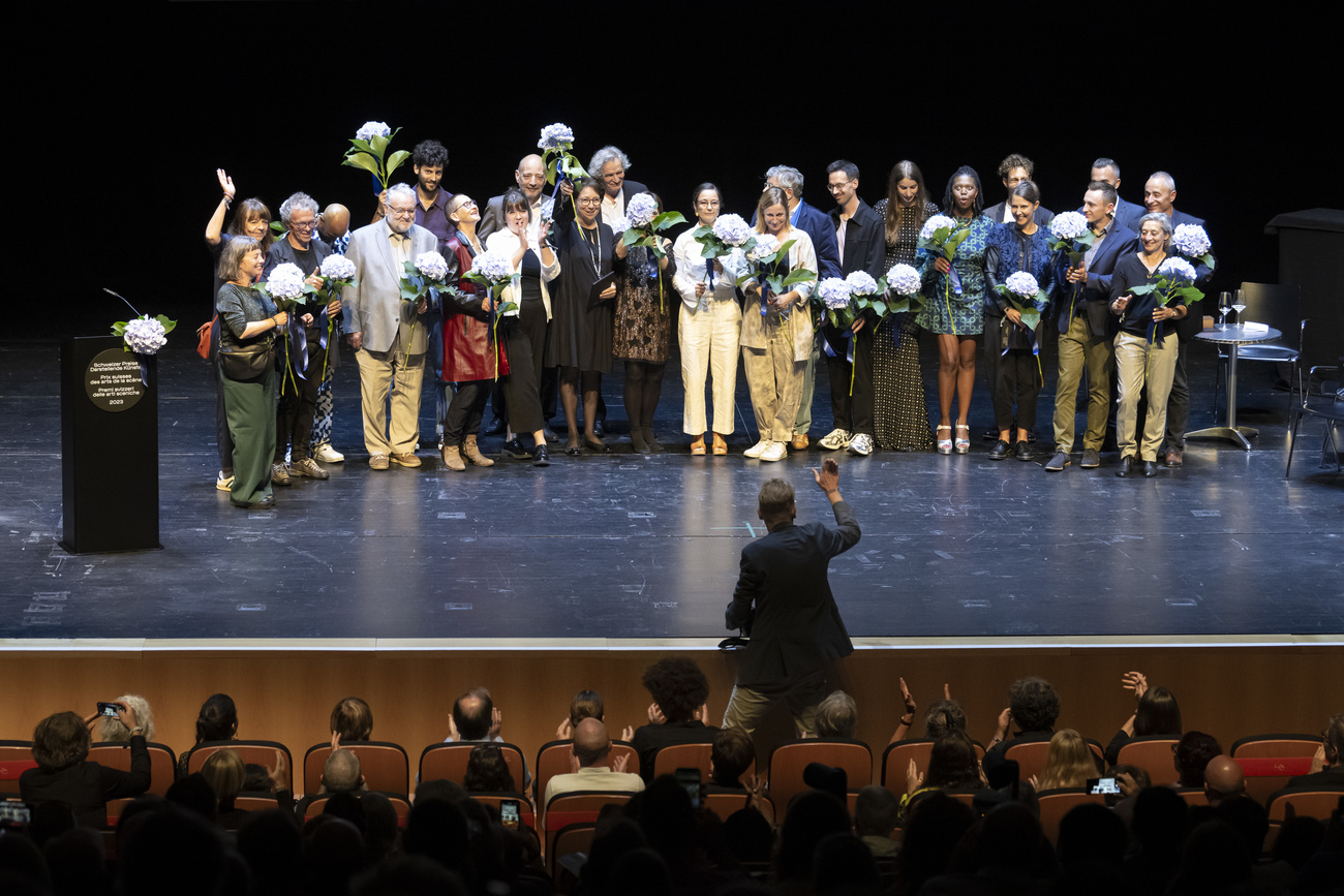 Receivers of the art prize in 2023 pose for a picture on stage