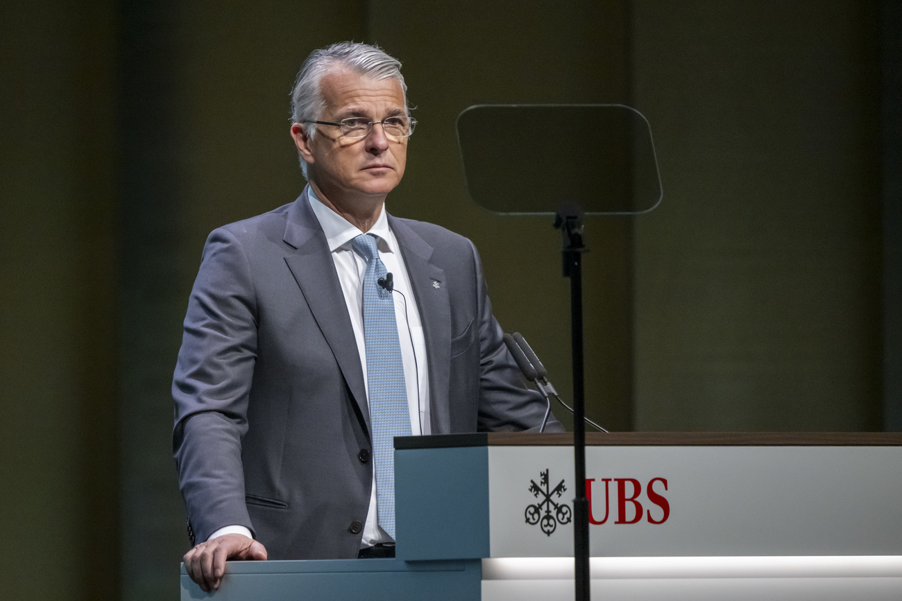 Sergio Ermotti, Chief Executive Officer of UBS bank speaks at a podium with the UBS logo.