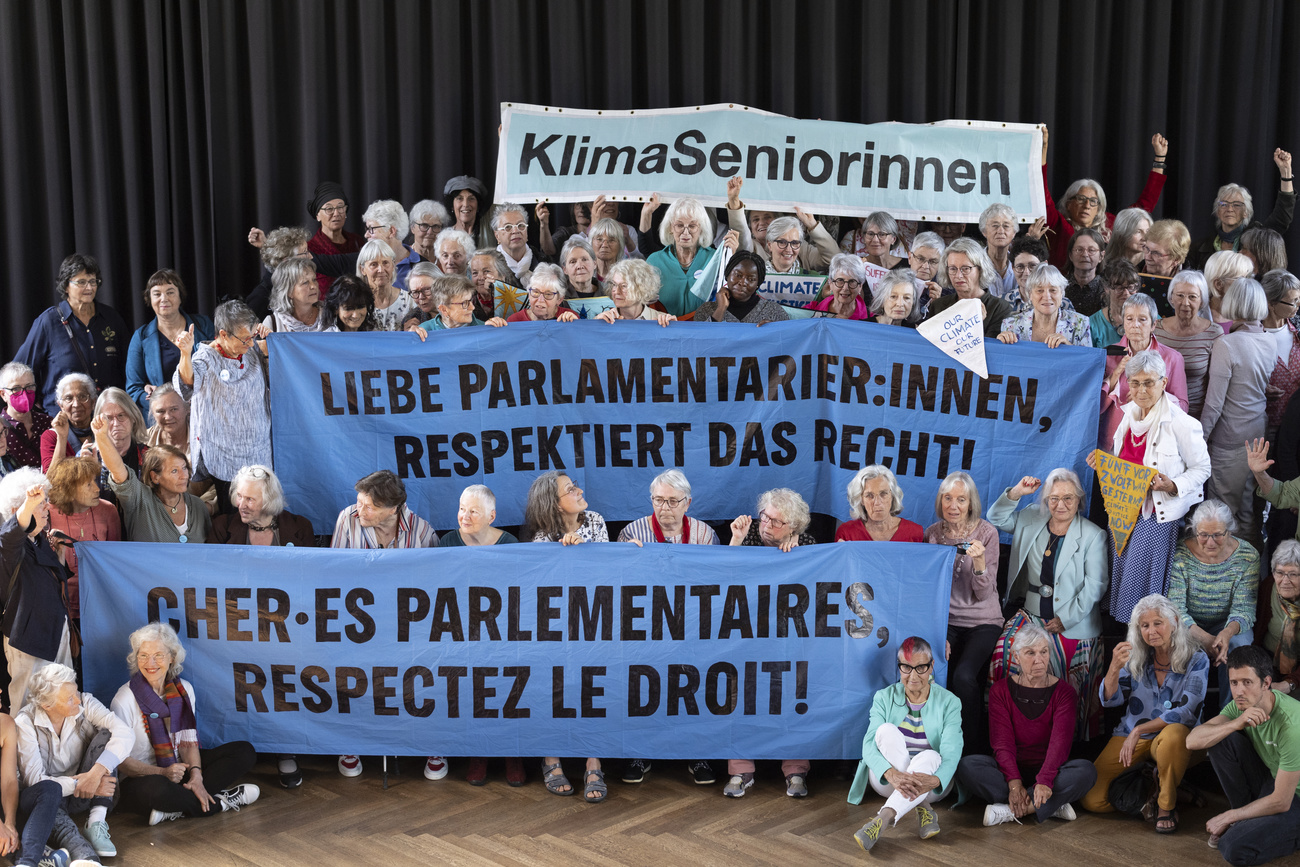 Members of the Klimaseniorinnen climate group pose for a protest photo aimed at Swiss parliamentarians, June 4, 2024.