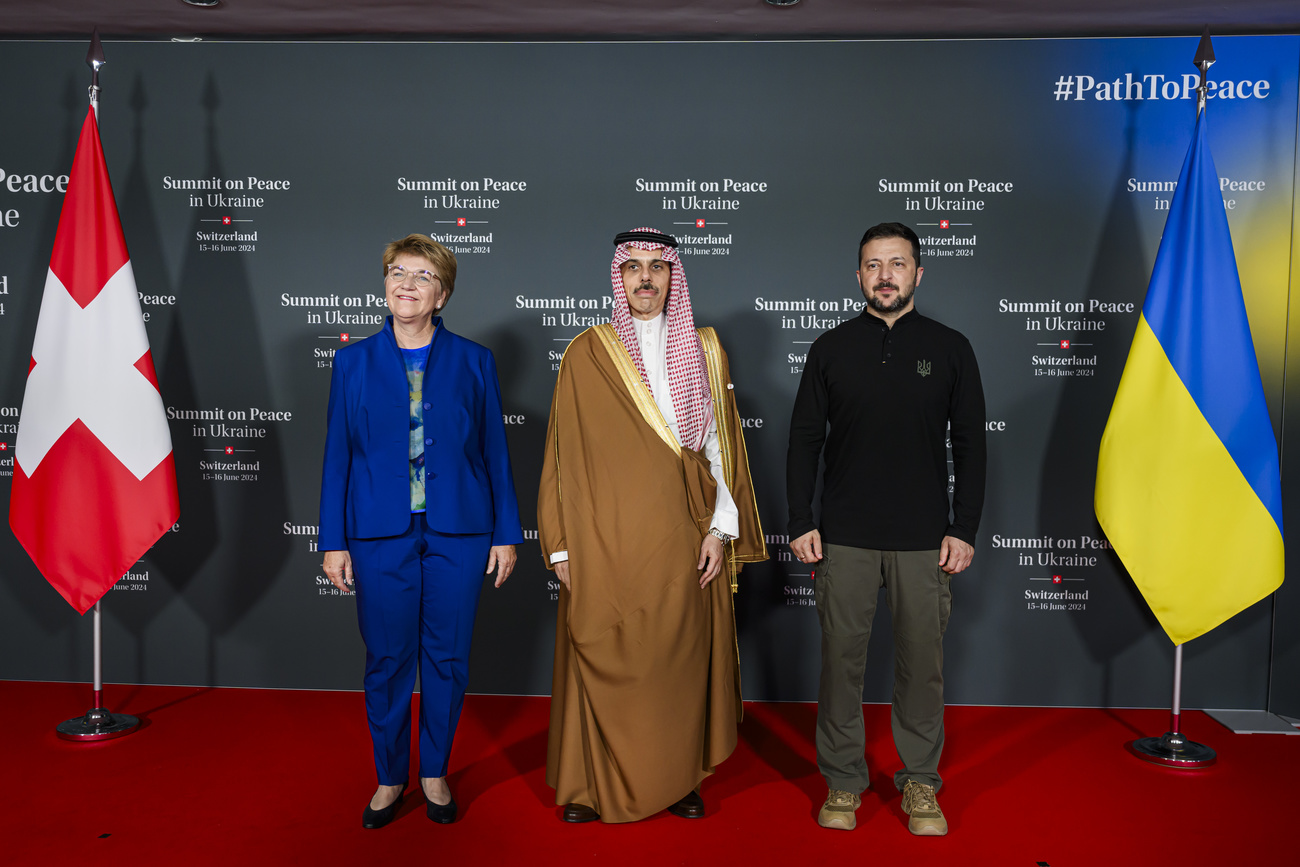 Swiss Federal President Viola Amherd (left) poses with Minister of Foreign Affairs Faisa bin Farhan Al Saud of Saudi Arabia (center) and President Volodymyr Zelenskyy of Ukraine (right) during the Summit on peace in Ukraine,