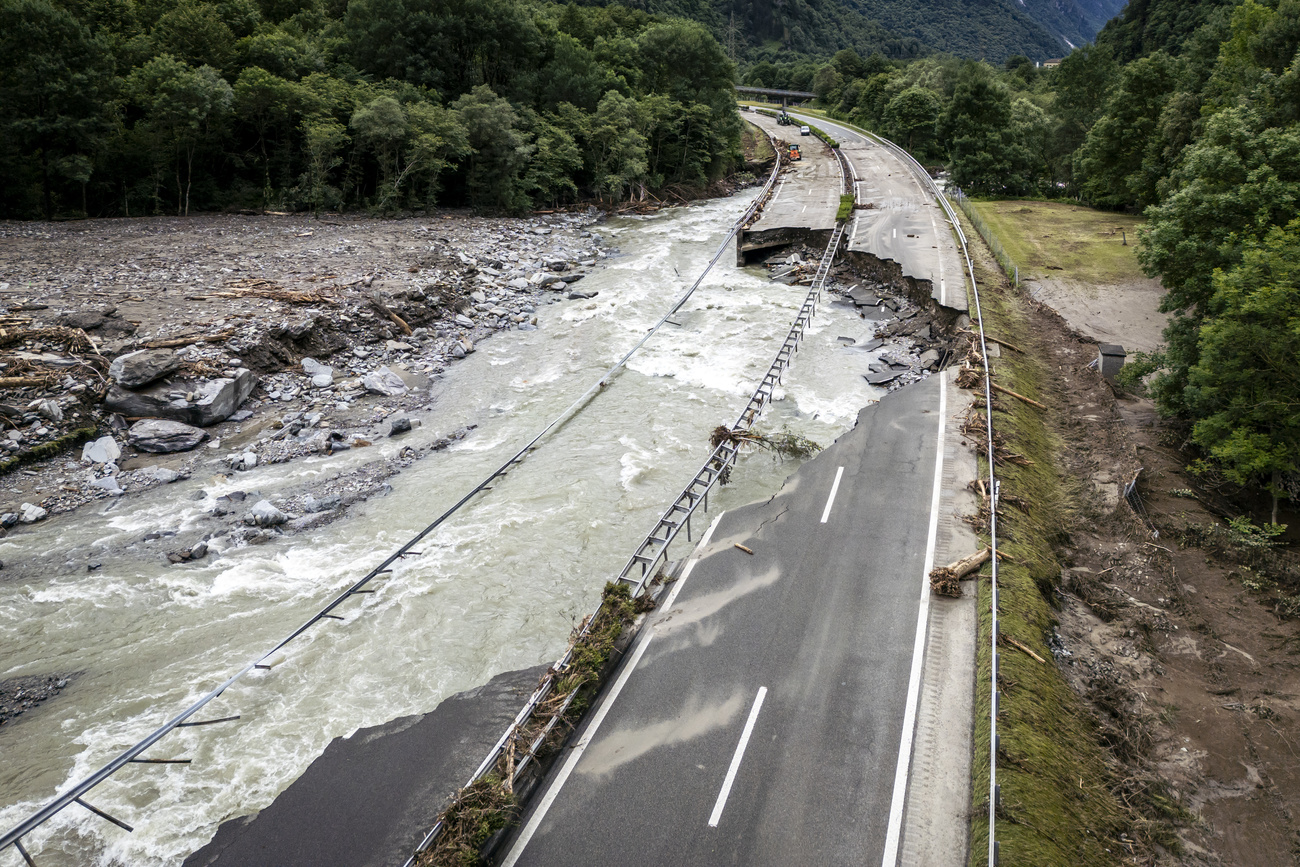 The highway A13 between Lostallo and Soazza destroyed by the force of the Moesa river, caused by heavy rain in the Misox valley, in Lostallo, southern Switzerland, on Sunday June 23, 2024. Massive thunderstorms and rainfall led to a flooding situation with large-scale landslides on Friday evening in the Misox valley, south-eastern Switzerland. Several dozen people had to be evacuated from their homes while three people are still missing on Sunday. (KEYSTONE/Michael Buholzer)