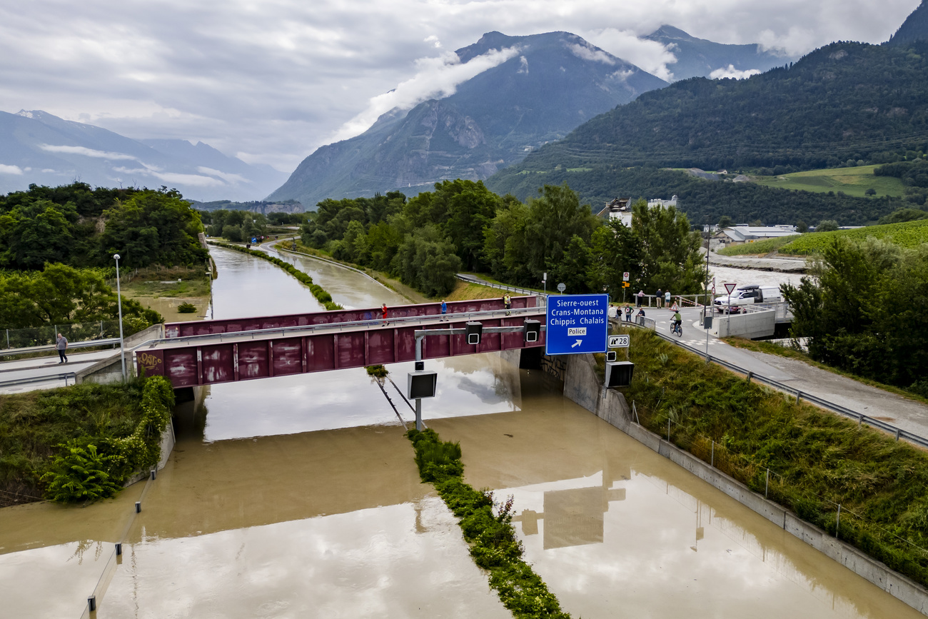 The Rhone River is overflowing the A9 motorway following the storms that caused major flooding, in Sierre, Switzerland, Sunday, June 30, 2024.