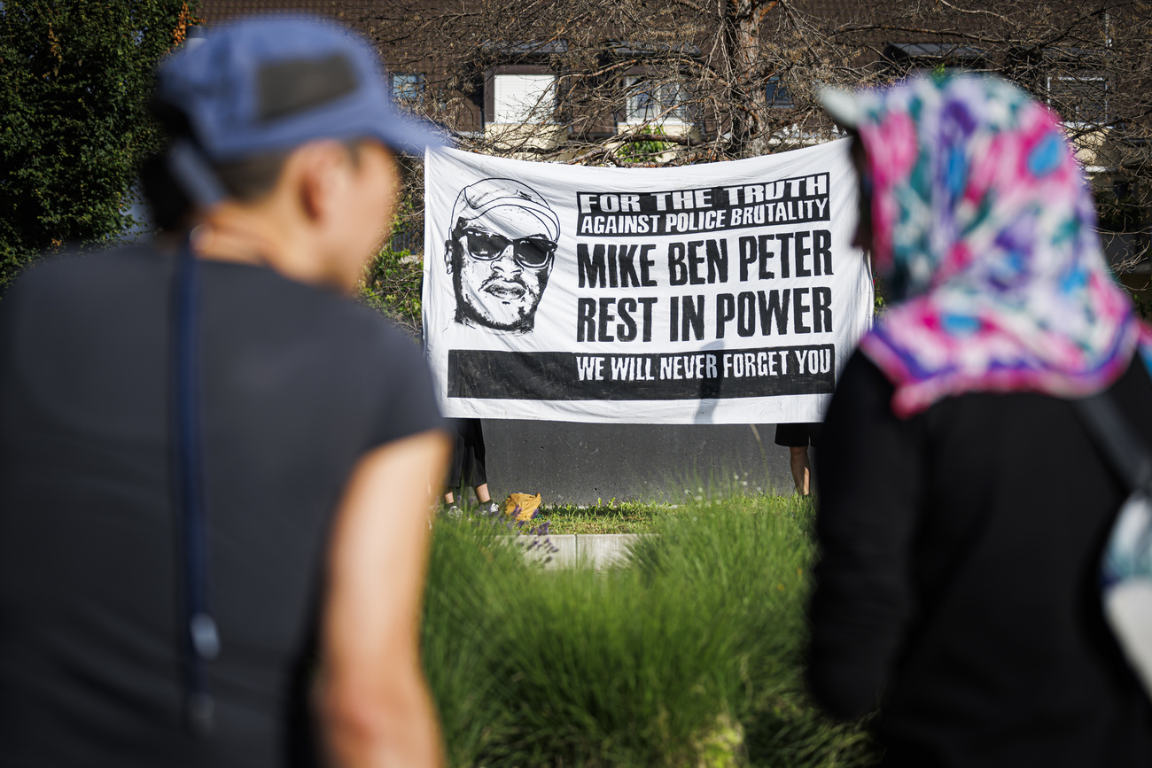 Demonstrators in front of the cantonal court of appeal ahead of the trial of six Lausanne police officers in the death of Mike Ben Peter