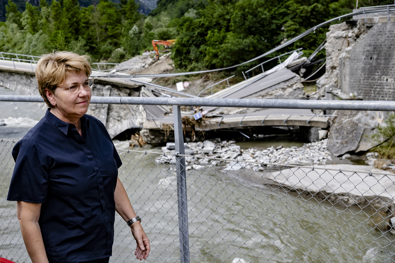 Swiss President Viola Amherd inspects the storm damage.