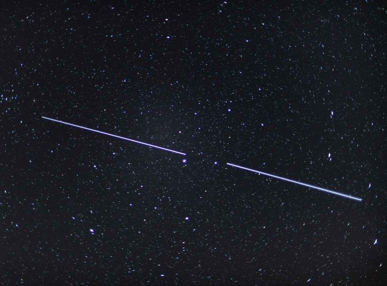 Two "Starlink" Satellites are visible as streaks of light in the night sky (image taken with an exposure time of 15 seconds). Early January 2020