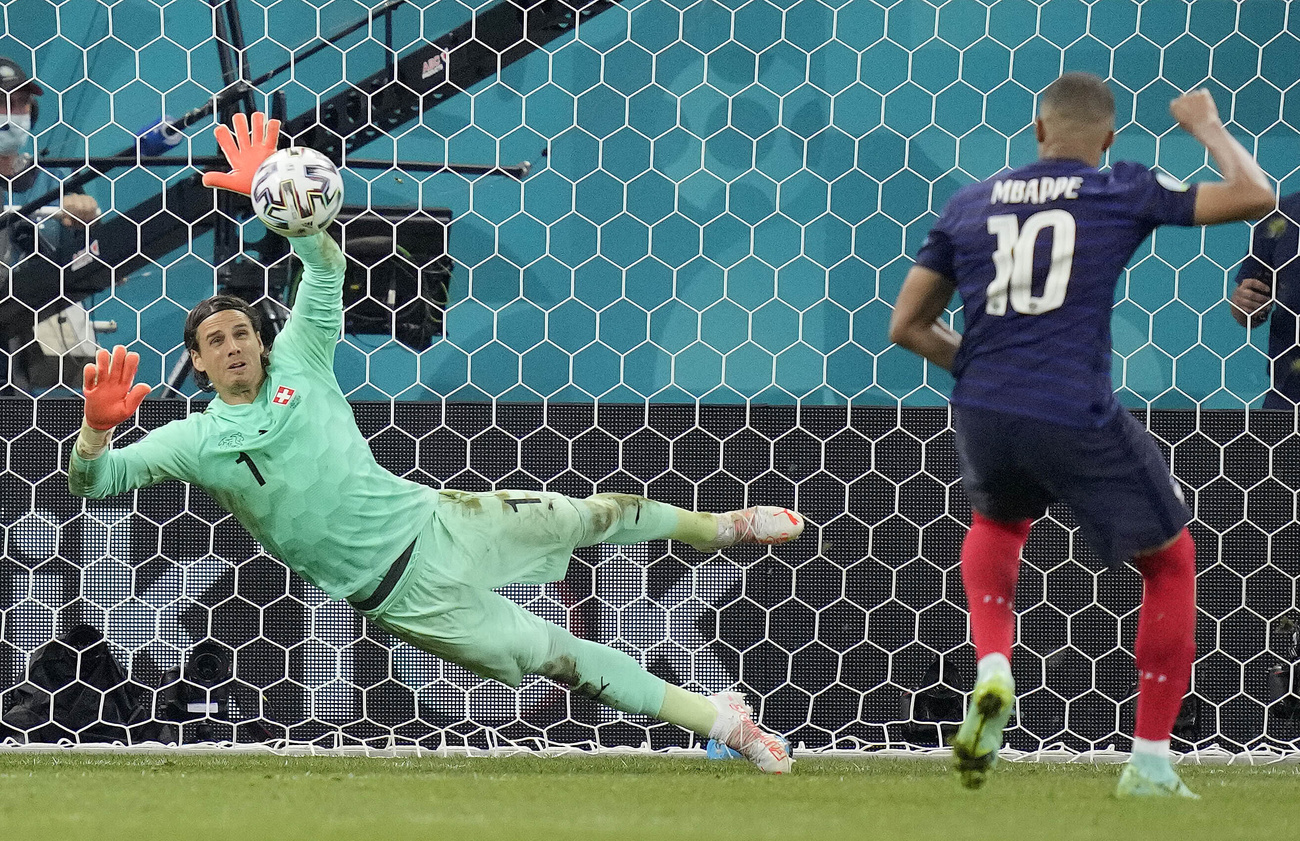 Swiss goalkeeper Yann Sommer saves the penalty kick of Frenchman Kylian Mbappe during the Euro 2020 soccer championship round of 16 match between France and Switzerland at the National Arena stadium in Bucharest, Romania, Tuesday, June 29, 2021. (AP Photo/Vadim Ghirda, Pool)