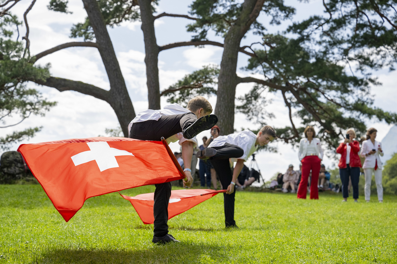 Picture of children playing with Swiss flags