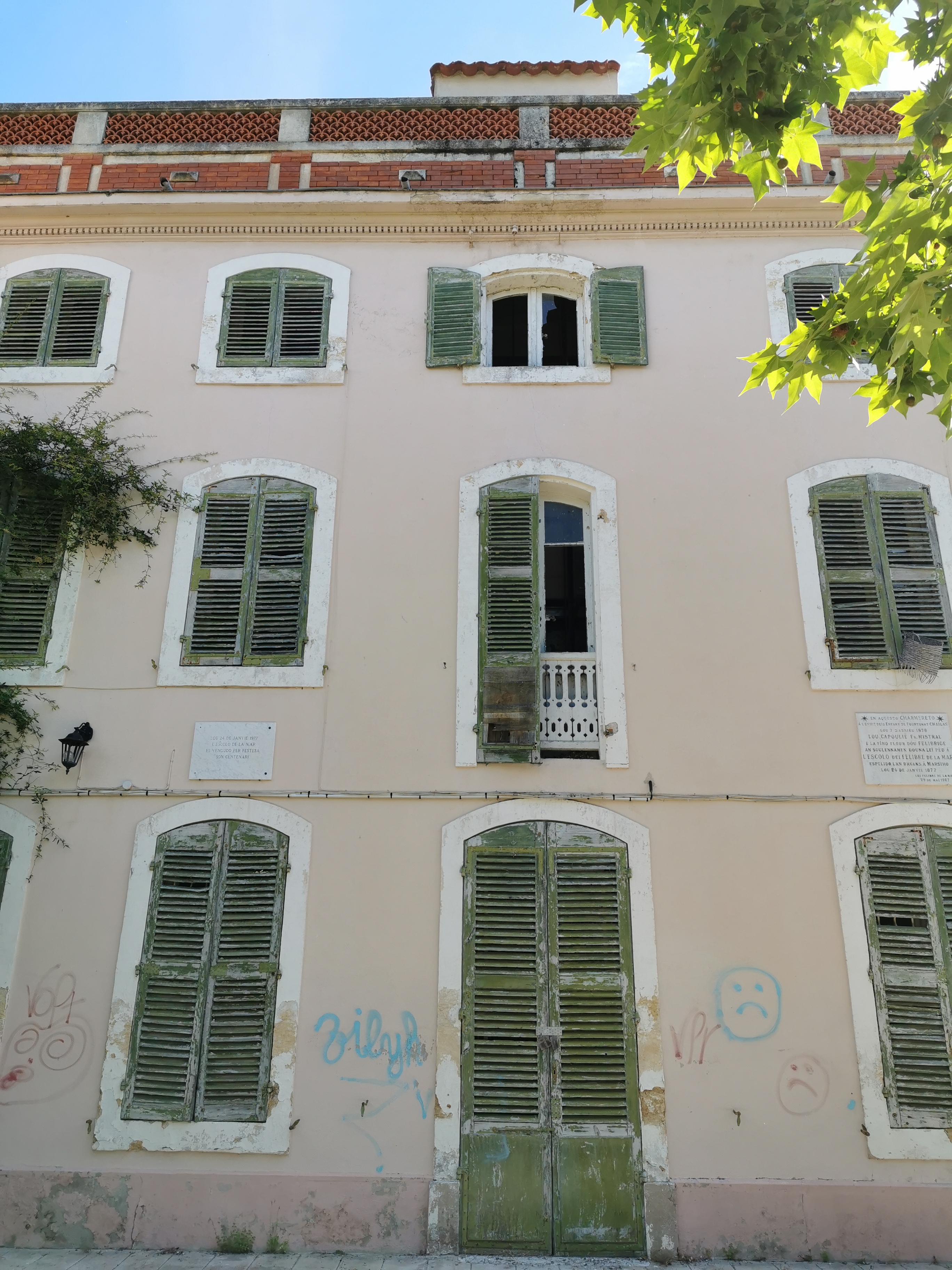 Some of the shutters on the front façade have even fallen down.