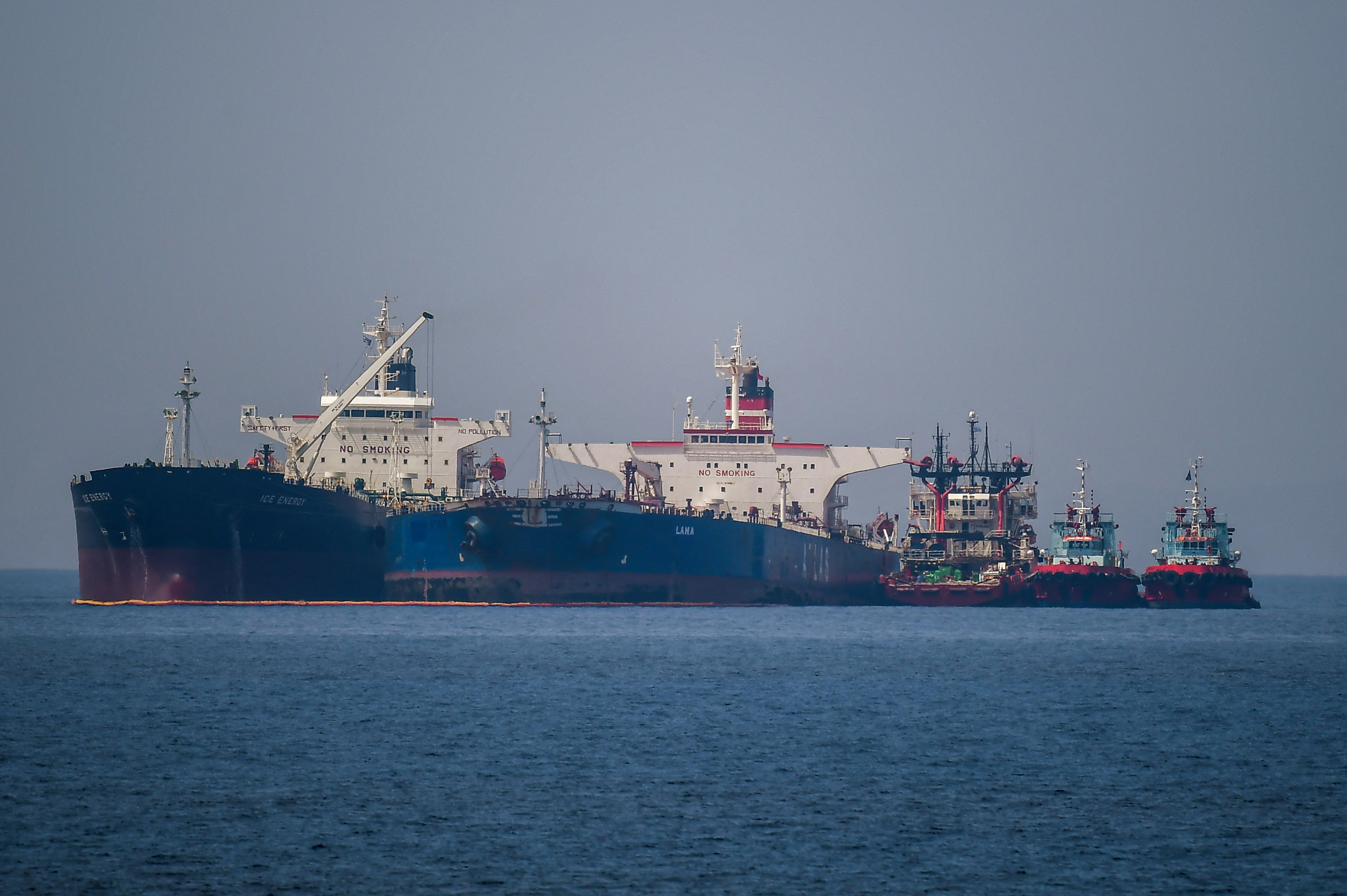 The Liberian-flagged oil tanker Ice Energy (L) transfers crude oil from the Russian-flagged oil tanker Lana (R) (former Pegas), off the shore of Karystos, on the Island of Evia, on May 29, 2022.