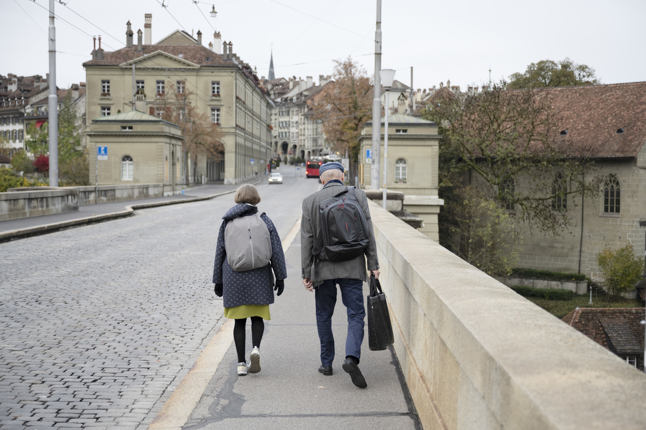 Picture of two people walking in the street