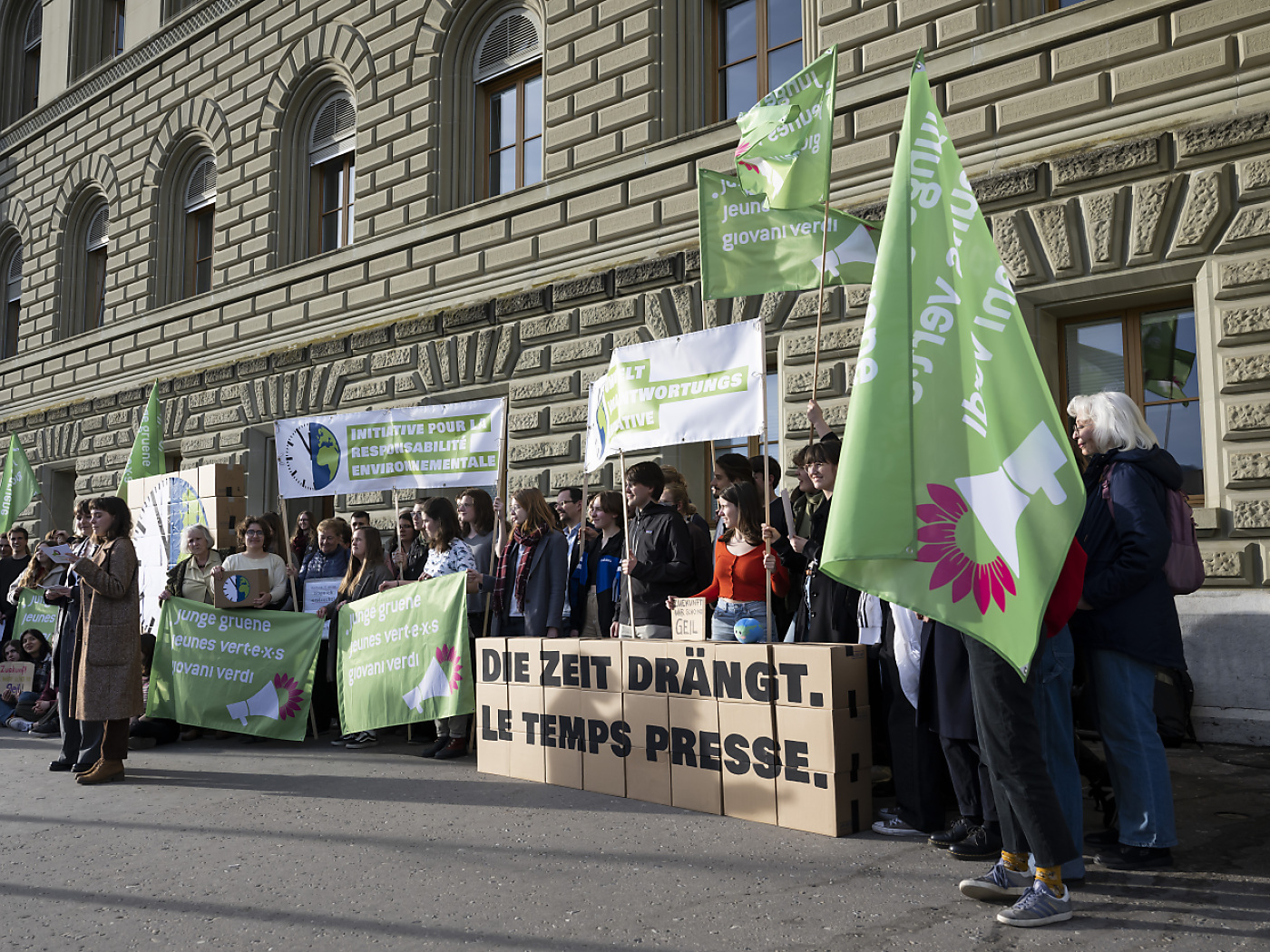 campaigners with green flags