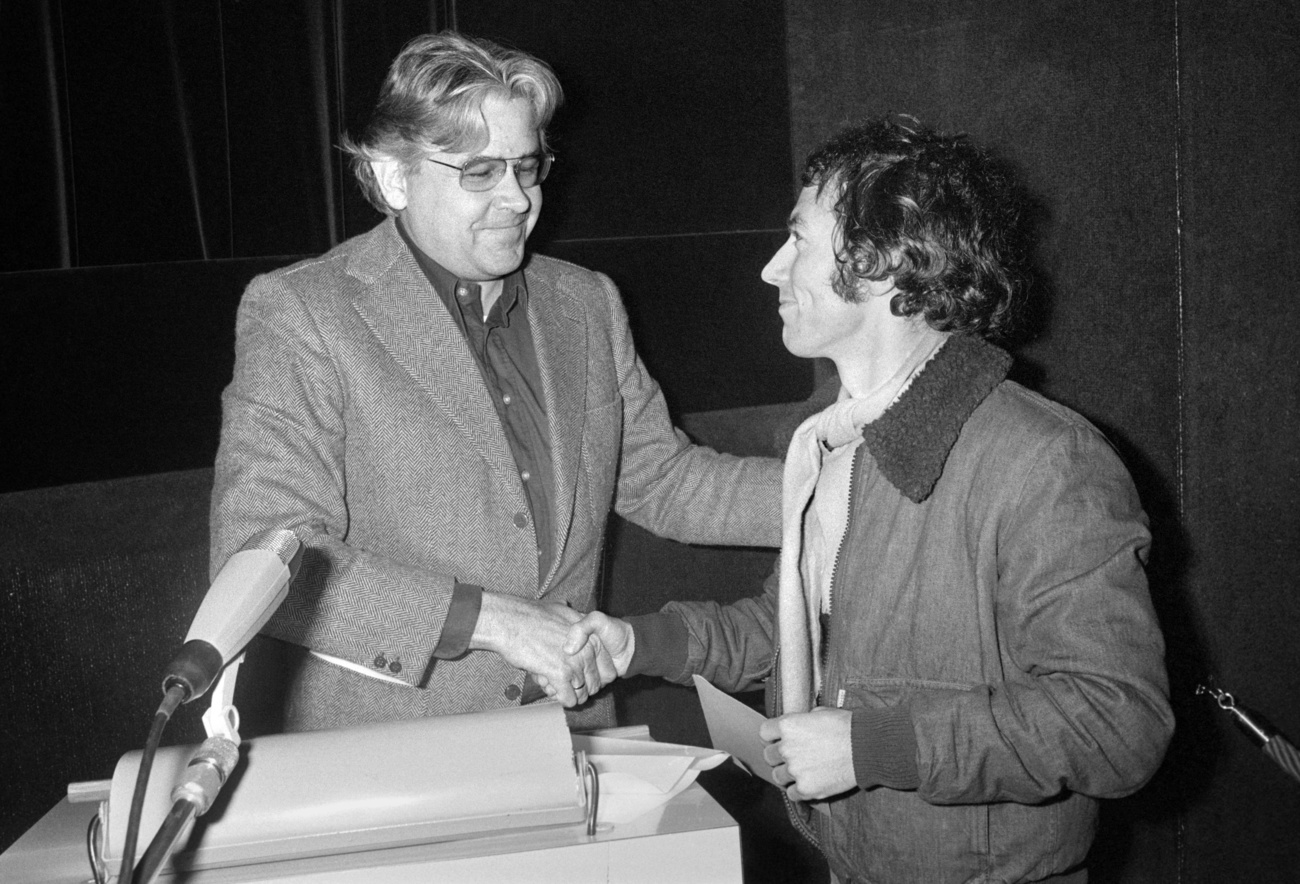 On 3 December 1977, Swiss film director Alexander J. Seiler, left, presents his colleague Richard Dindo, right, with the ‘Zurich Film Prize 1977’ for his film ‘ The Execution of National Traitor Ernst S.’. Seiler is one of the 16 film-makers honoured in Zurich who, as a sign of solidarity, donated a percentage of their prize money to Dindo for his achievements, as Dindo was not nominated by the Zurich cantonal government.