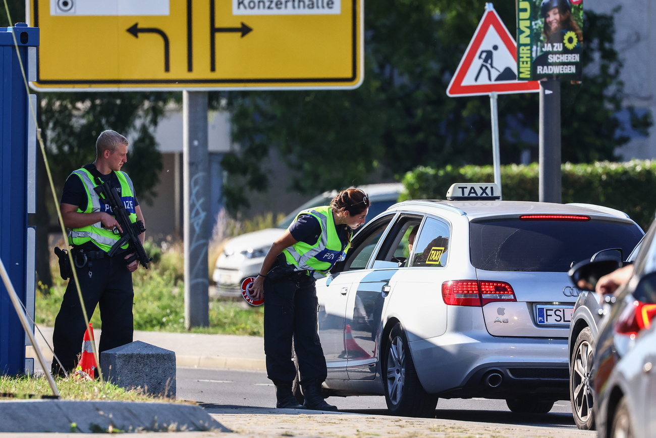 German police officers stop a car at a German federal police checkpoint at the German-Polish border in Frankfurt Oder, Germany, 21 September 2024. Germany started expanding its border controls with its nine neighboring countries on 16 September 2024, with the aim to limit irregular migration. Since Germany reinstated temporary checks on its borders with Poland, the Czech Republic, Austria, and Switzerland in October 2023, federal police have recorded nearly 52,000 illegal border crossings and denied entry to about 30,000 individuals, according to the German Federal Ministry of the Interior and Community. EPA/FILIP SINGER