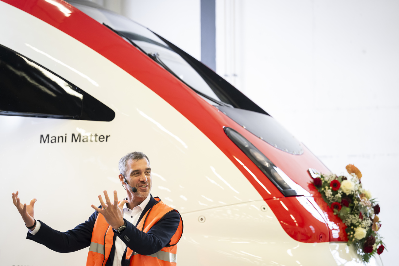 man standing in front of a train