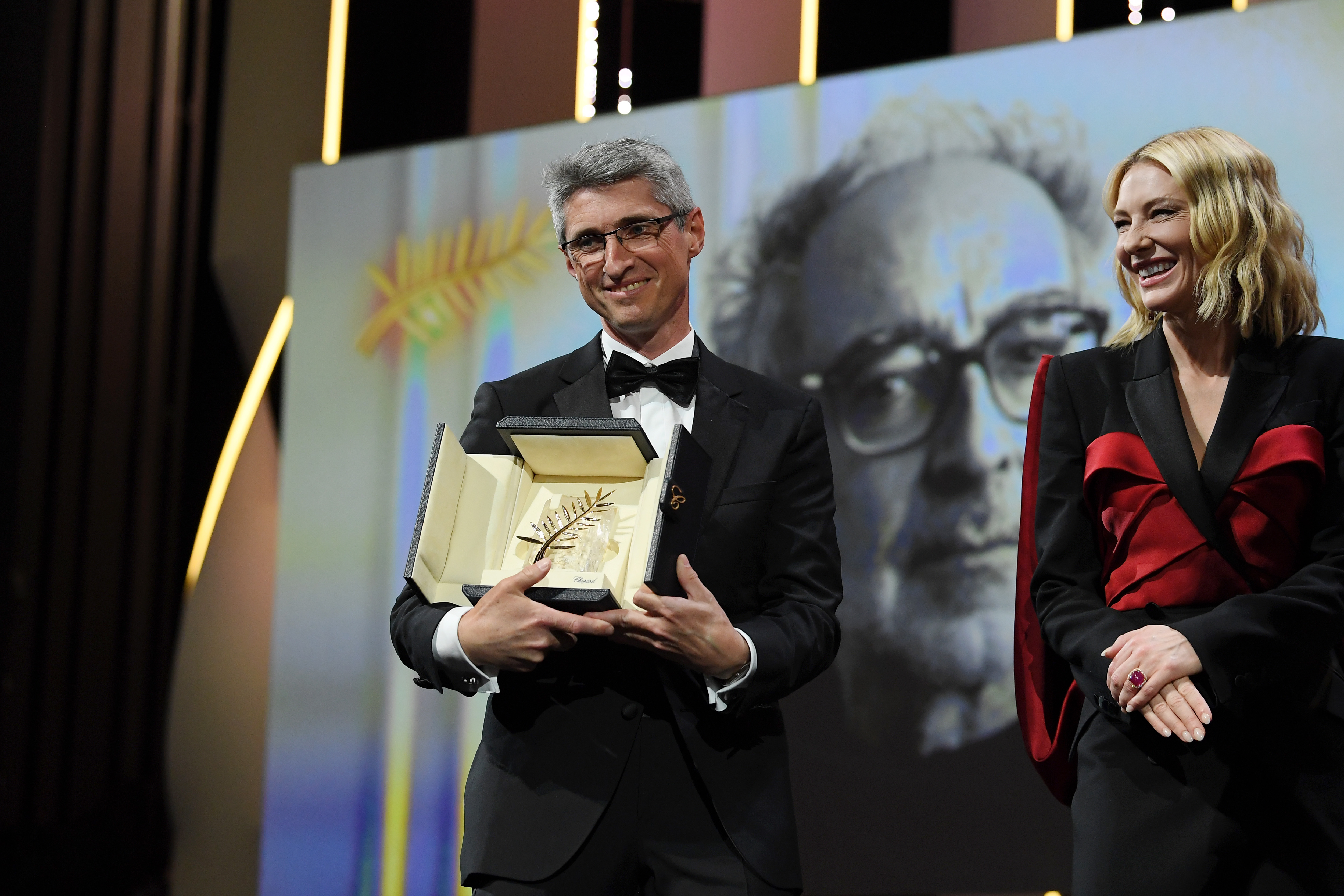 Fabrice Aragno receives a Special Palme d'Or award on behalf of director Jean-Luc Godard for his film 'The Image Book' (Le Livre D'Image) during the closing ceremony of the 71st annual Cannes Film Festival, May 2018.