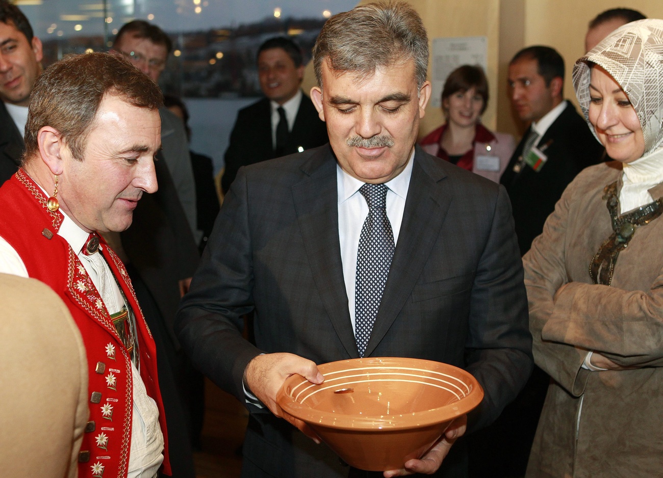 Turkish President Abdullah Gul tries his hand at Talerschwingen during a state visit to Switzerland in 2010.