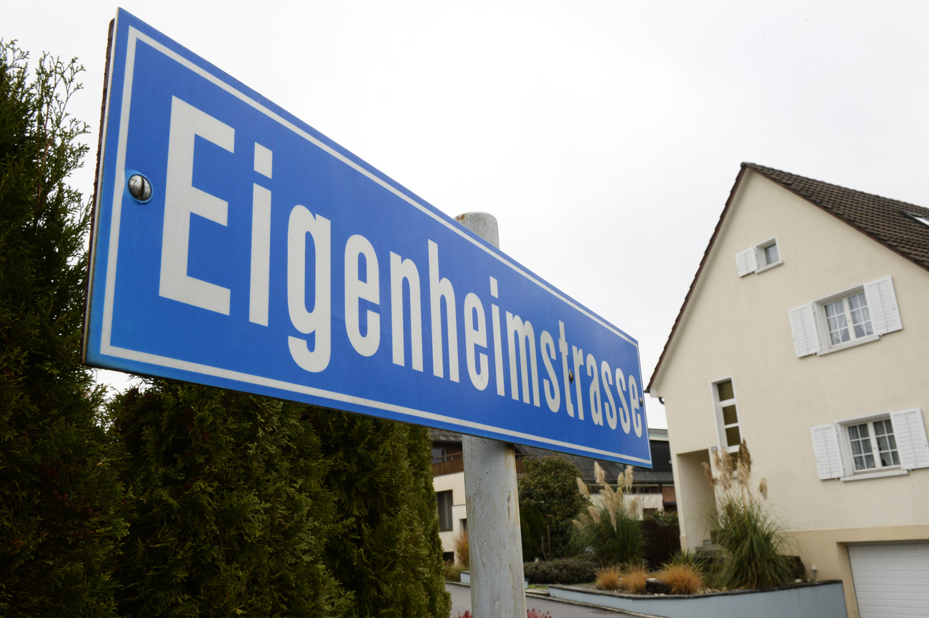 House and road sign.