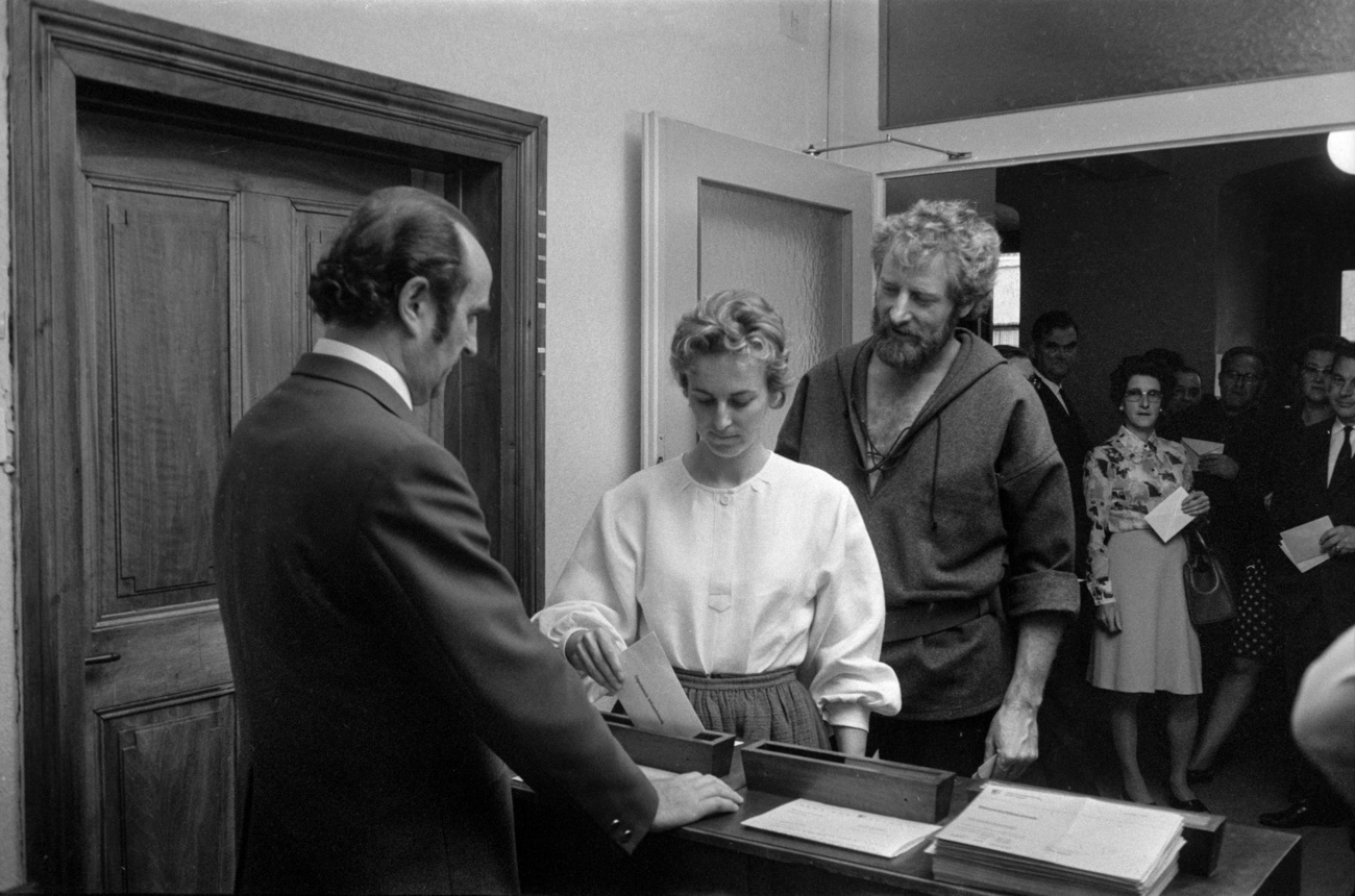 black-and-white photo of woman voting