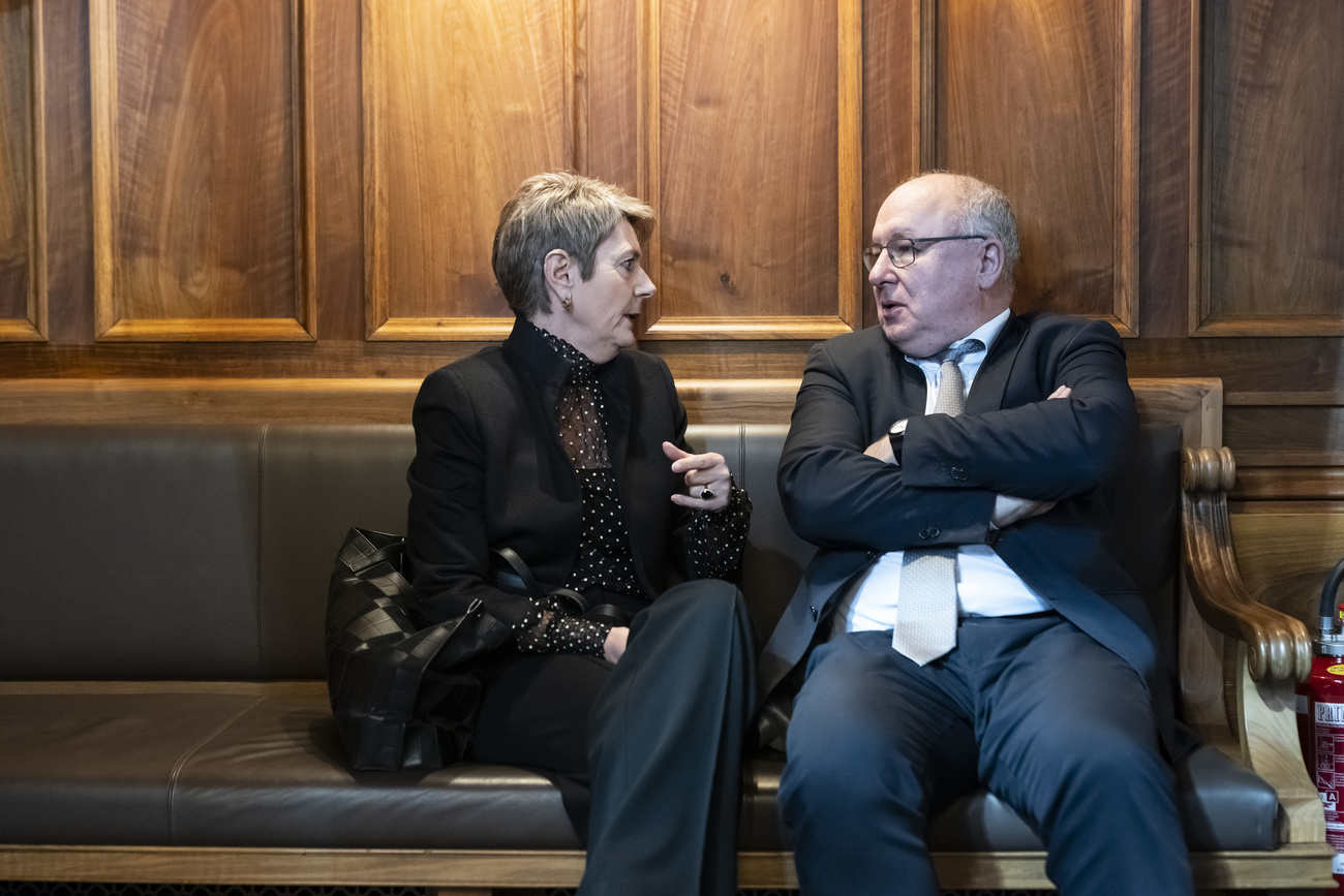 Finance Minister Karin Keller-Sutter (left) talks to Senator Pierre-Yves Maillard in parliament in Bern on March 14, 2024.